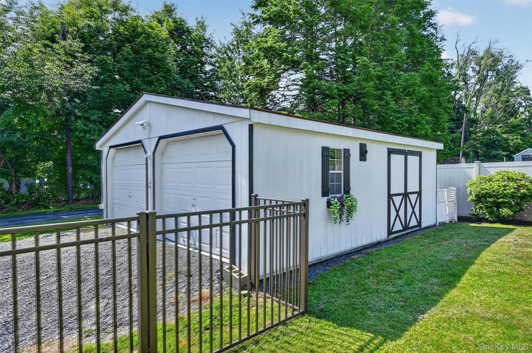 The insulated detached garage with electric is located on the opposite side of the home from the attached garage, offering excellent space for vehicle storage, seasonal items, yard equipment, or a workshop. The insulated detached garage with electric is located on the opposite side of the home from the attached garage, offering excellent space for vehicle storage, seasonal items, yard equipment, or a workshop.