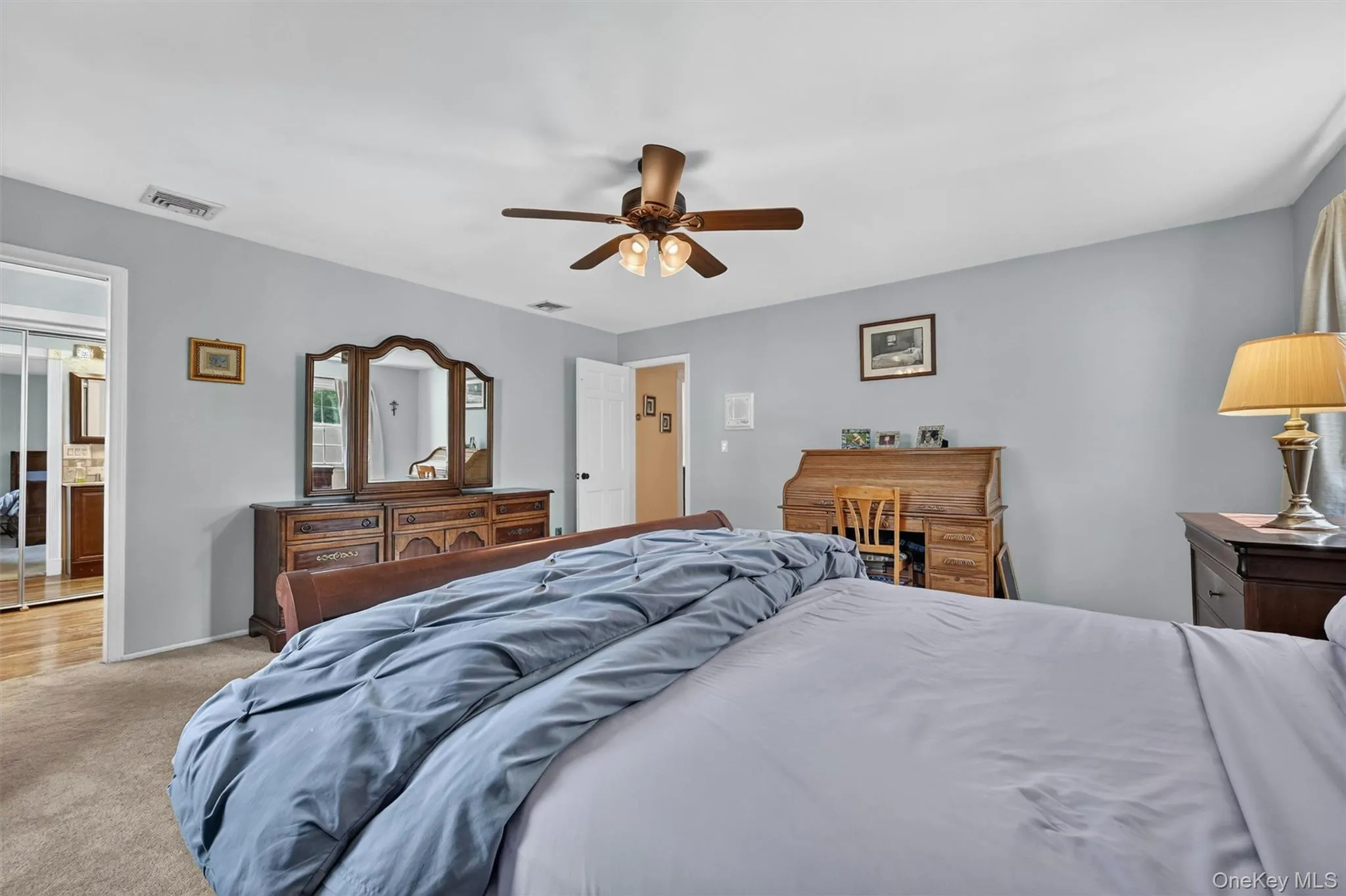This primary bedroom is spacious and offers plenty of space for a full bedroom set as well as a desk or seating area. This primary bedroom is spacious and offers plenty of space for a full bedroom set as well as a desk or seating area.