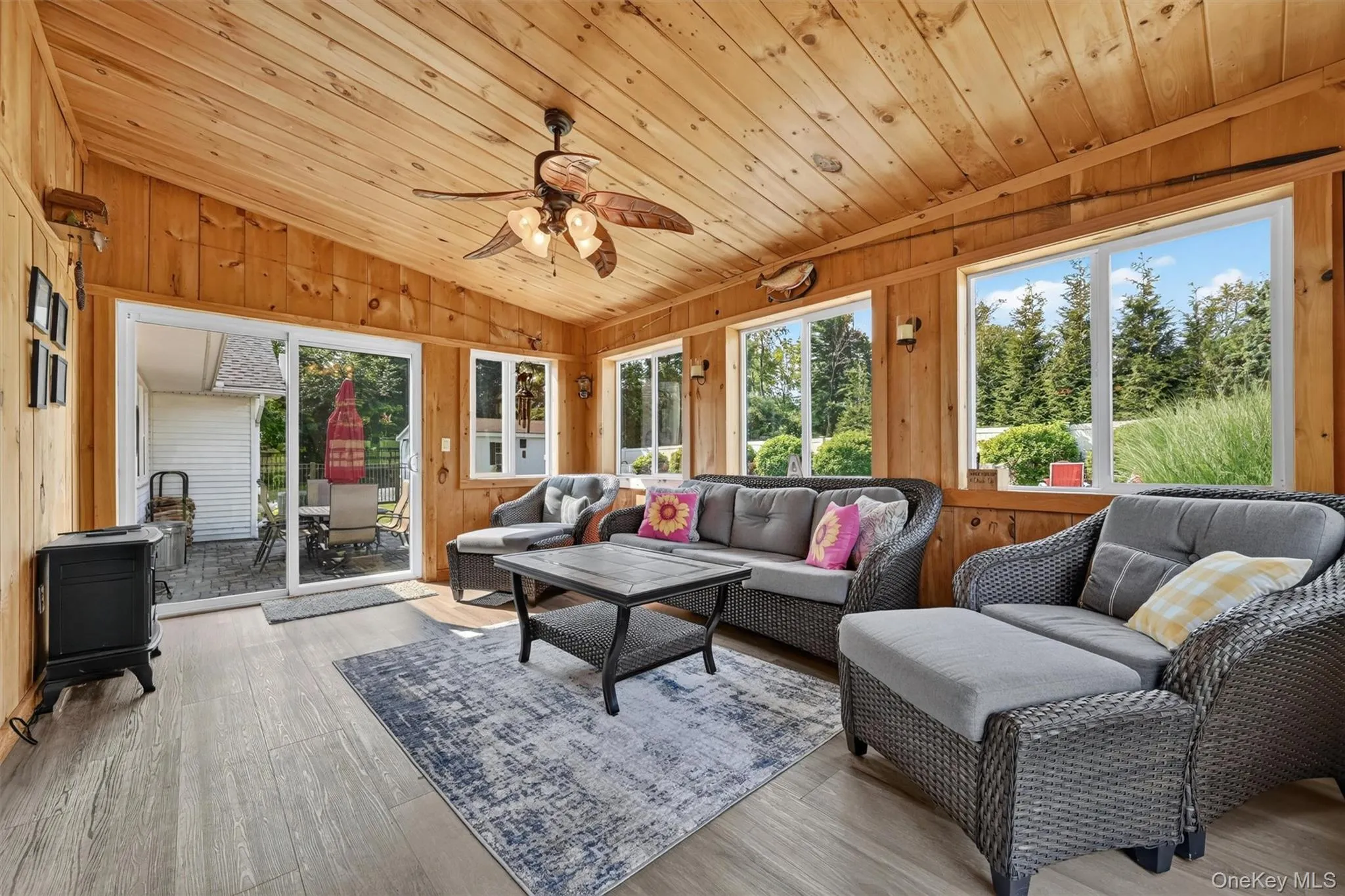 The three-season sunroom is sure to become a favorite spot, surrounded by windows and overlooking the backyard oasis. The three-season sunroom is sure to become a favorite spot, surrounded by windows and overlooking the backyard oasis.