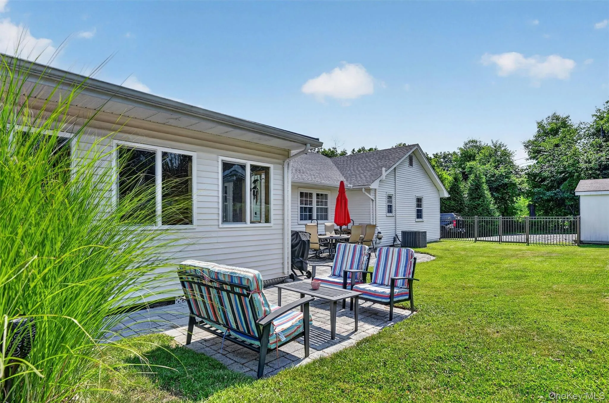 The backyard offers multiple patio areas for dining, lounging, and entertaining, giving everyone a place to gather or unwind. The backyard offers multiple patio areas for dining, lounging, and entertaining, giving everyone a place to gather or unwind.