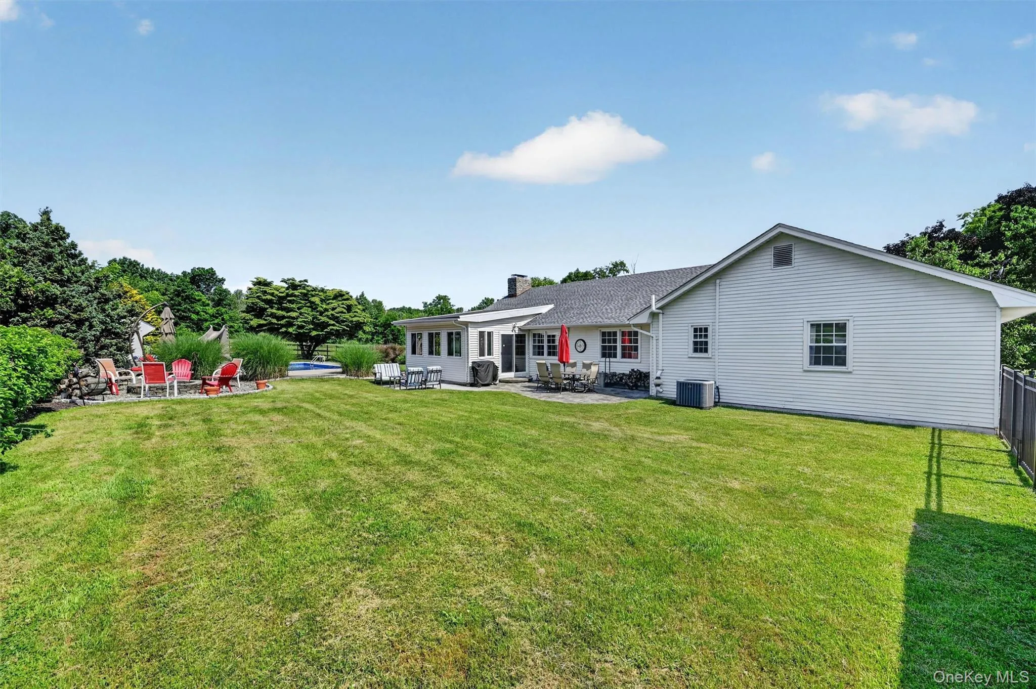 A level, private backyard with room to relax, play, entertain, and enjoy the outdoor setting. A level, private backyard with room to relax, play, entertain, and enjoy the outdoor setting.