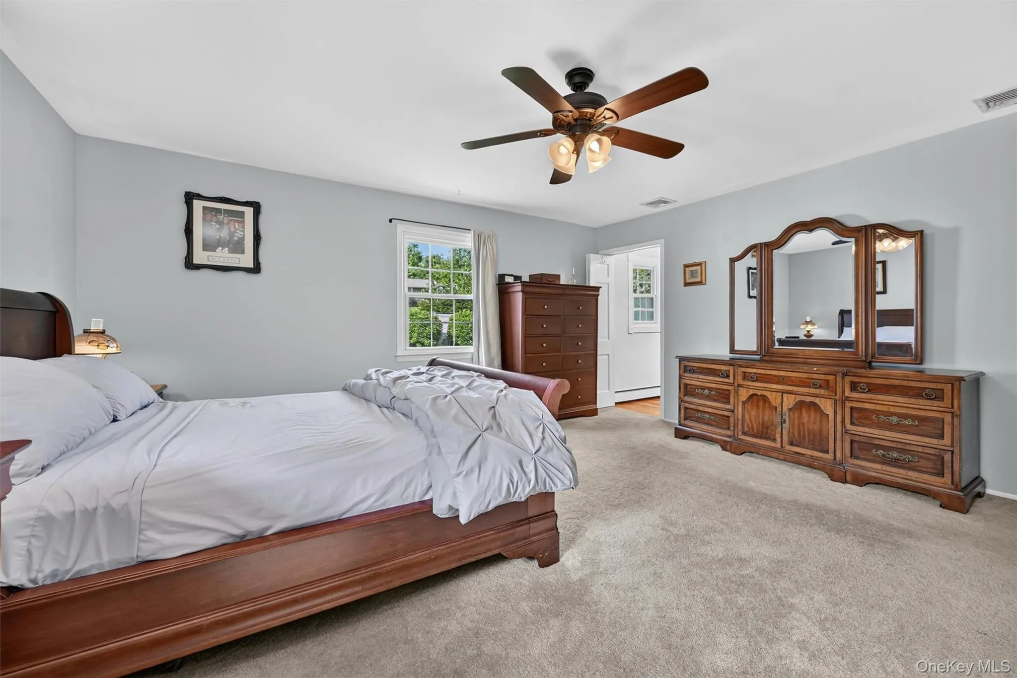 A generous primary suite with neutral tones, multiple windows, and a private en suite bath designed for everyday comfort. A generous primary suite with neutral tones, multiple windows, and a private en suite bath designed for everyday comfort.