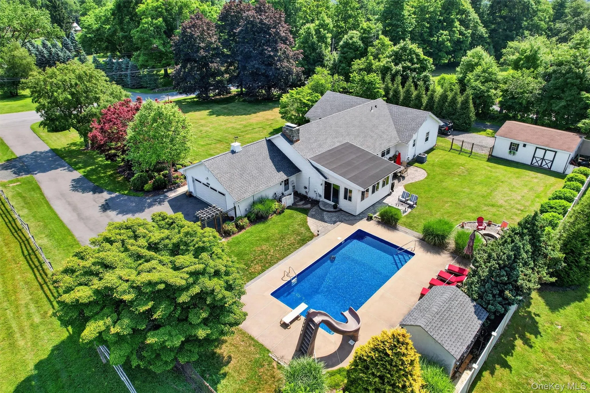 Set on 0.92 level and private acres, this Warwick property offers a spacious ranch home, inground pool, two garages, and a backyard designed for everyday enjoyment. Set on 0.92 level and private acres, this Warwick property offers a spacious ranch home, inground pool, two garages, and a backyard designed for everyday enjoyment.