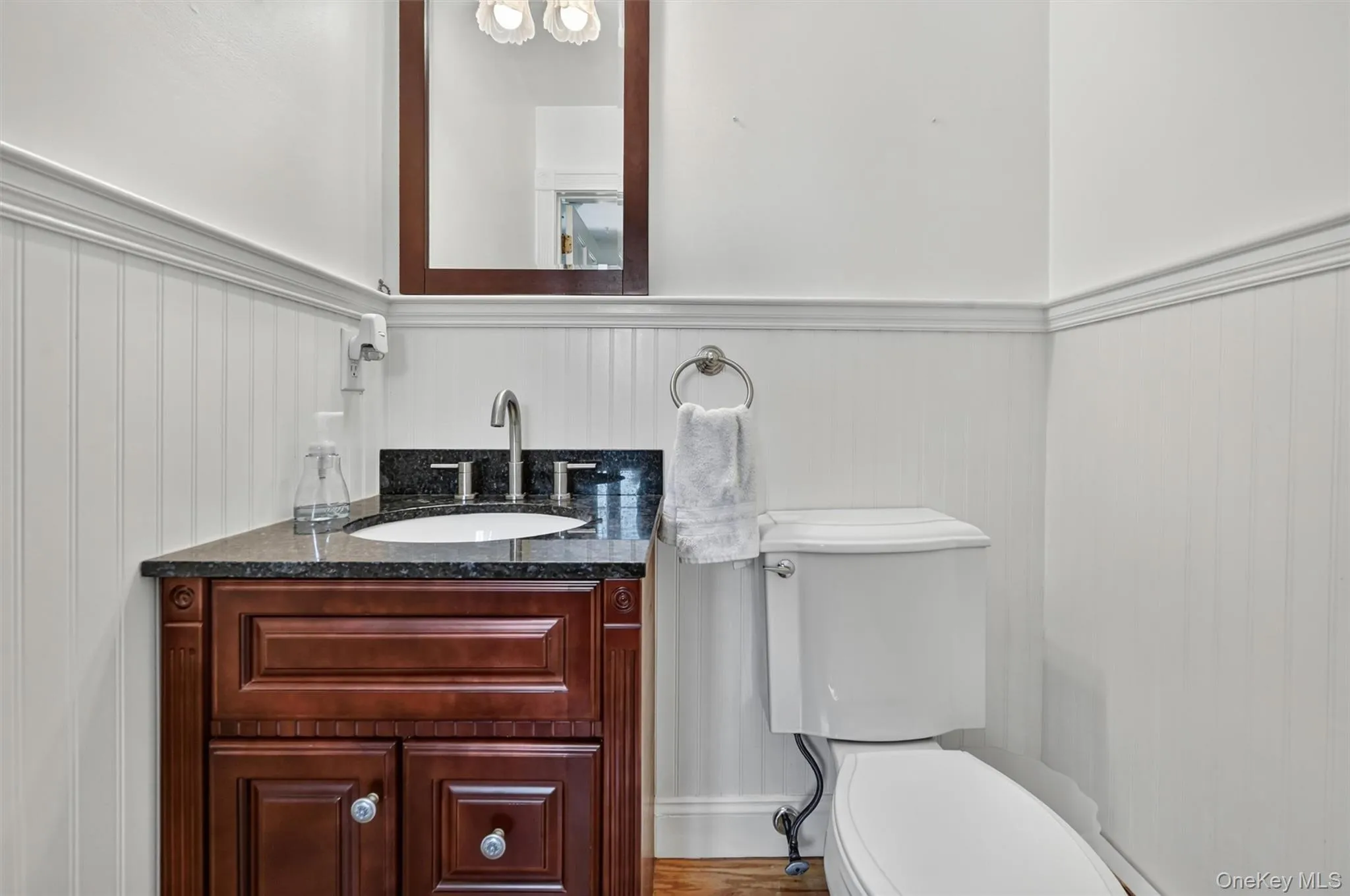 Conveniently located just off the mudroom/laundry room, this updated half bath adds everyday function right where it is needed most. Conveniently located just off the mudroom/laundry room, this updated half bath adds everyday function right where it is needed most.