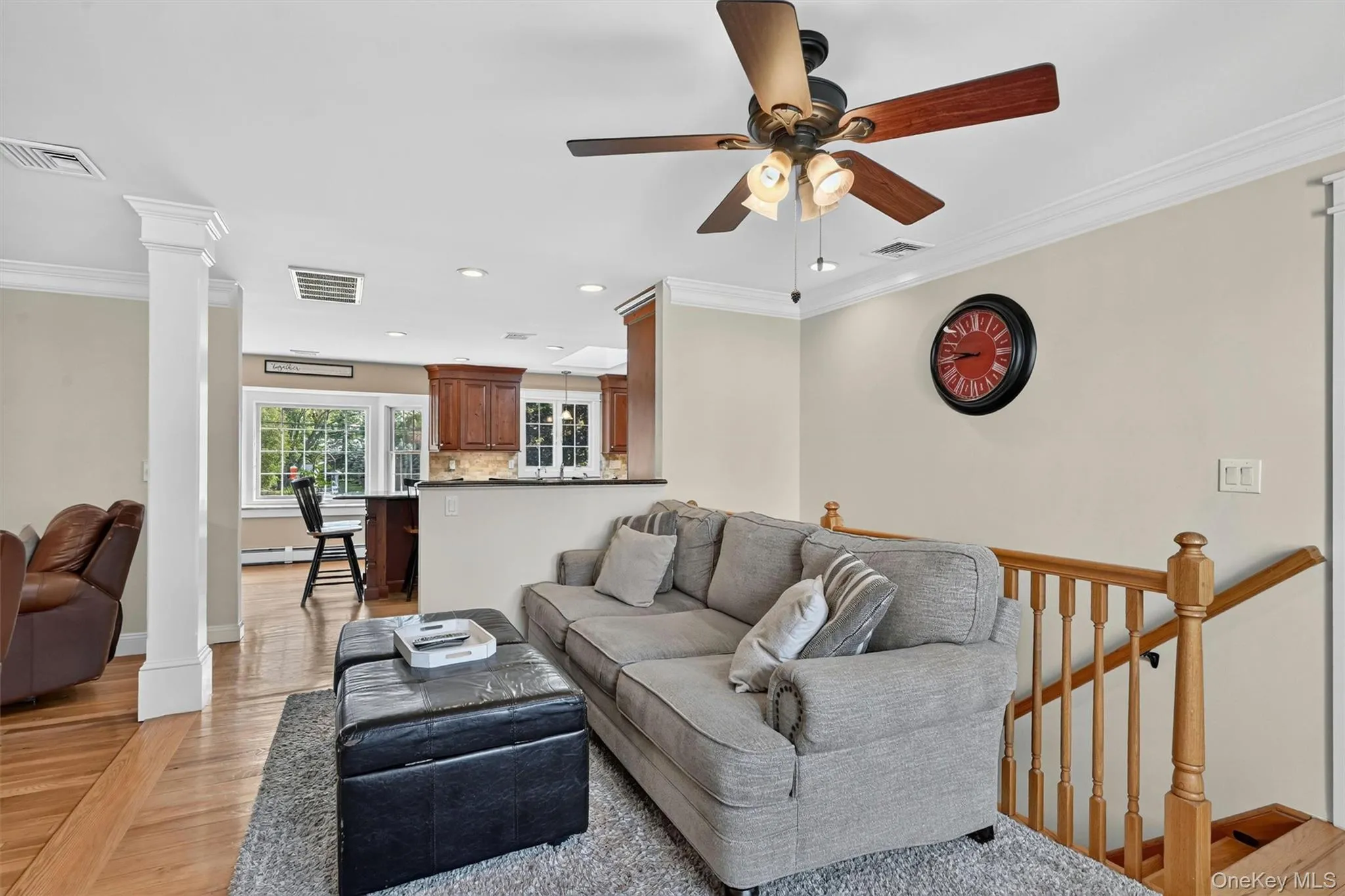 A comfortable everyday living area with open flow to the kitchen, plus nearby stairs leading to the basement. A comfortable everyday living area with open flow to the kitchen, plus nearby stairs leading to the basement.