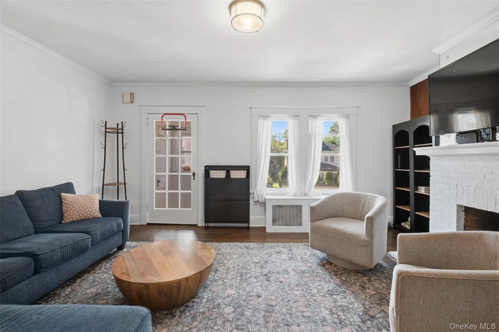 Living room with fireplace and hardwood flooring Living room with fireplace and hardwood flooring