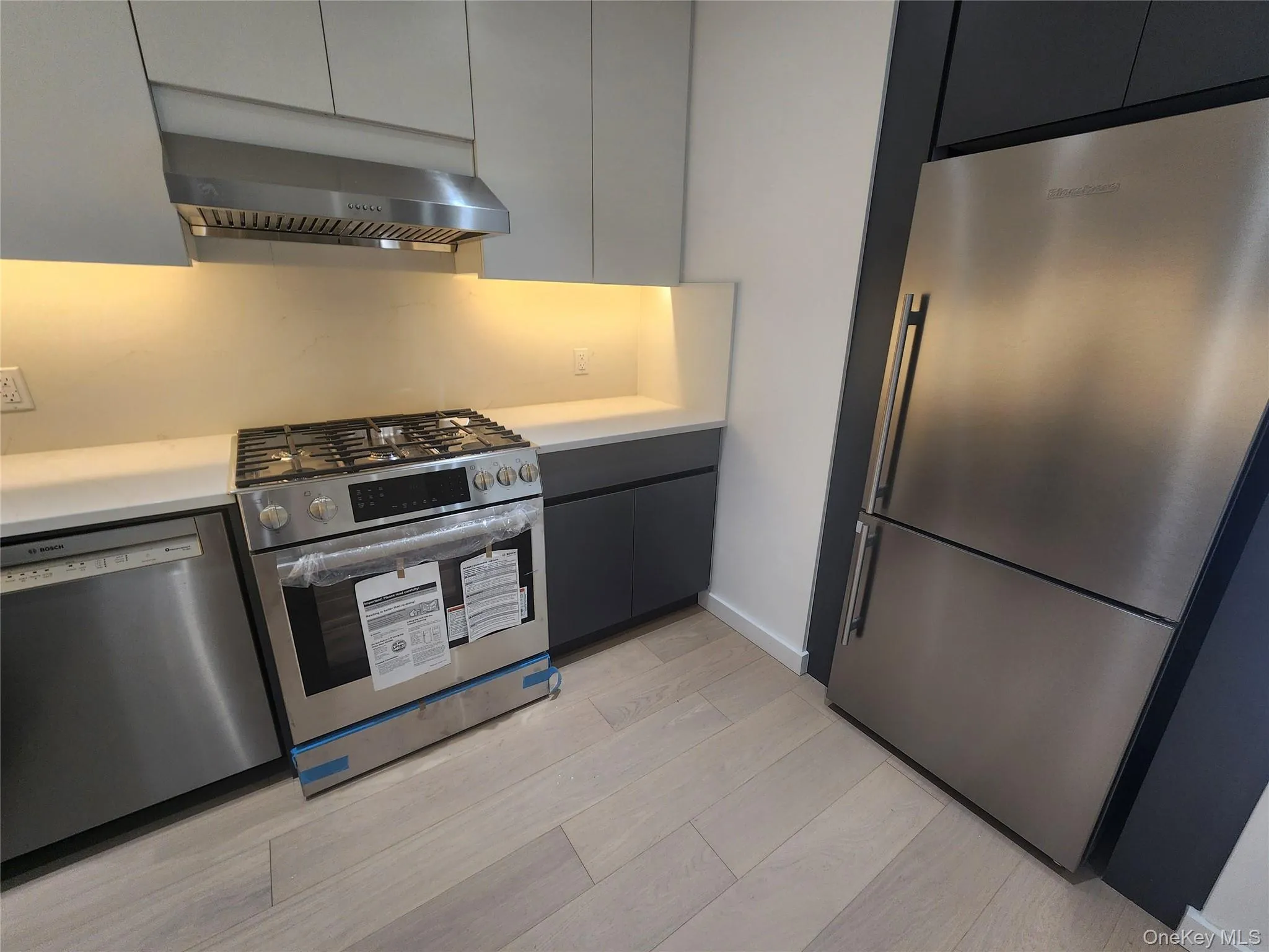 Kitchen featuring stainless steel appliances, including a gas range, dishwasher, and refrigerator Kitchen featuring stainless steel appliances, including a gas range, dishwasher, and refrigerator
