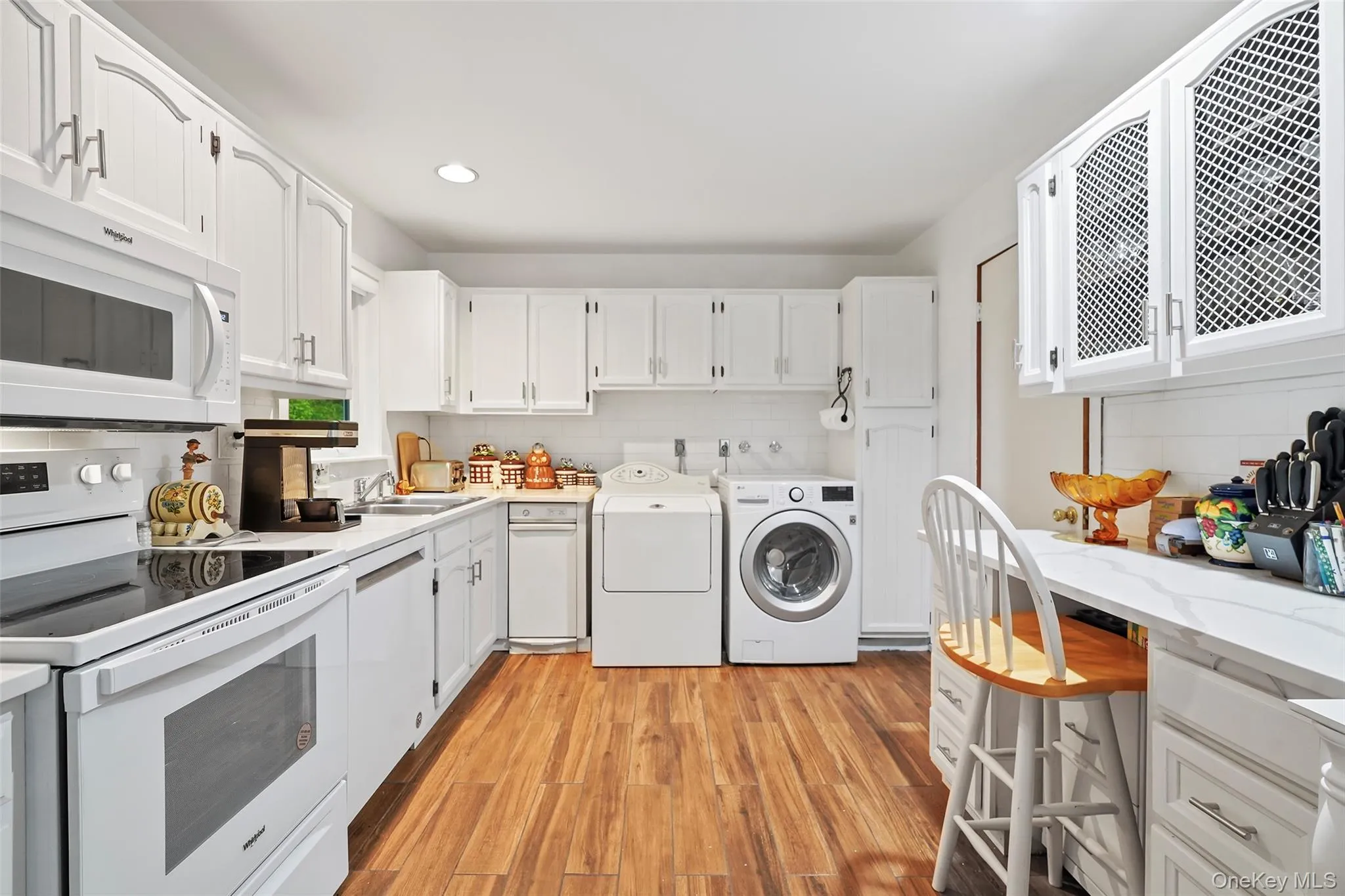 Kitchen with washer and dryer, which can be relocated to main lower level Kitchen with washer and dryer, which can be relocated to main lower level