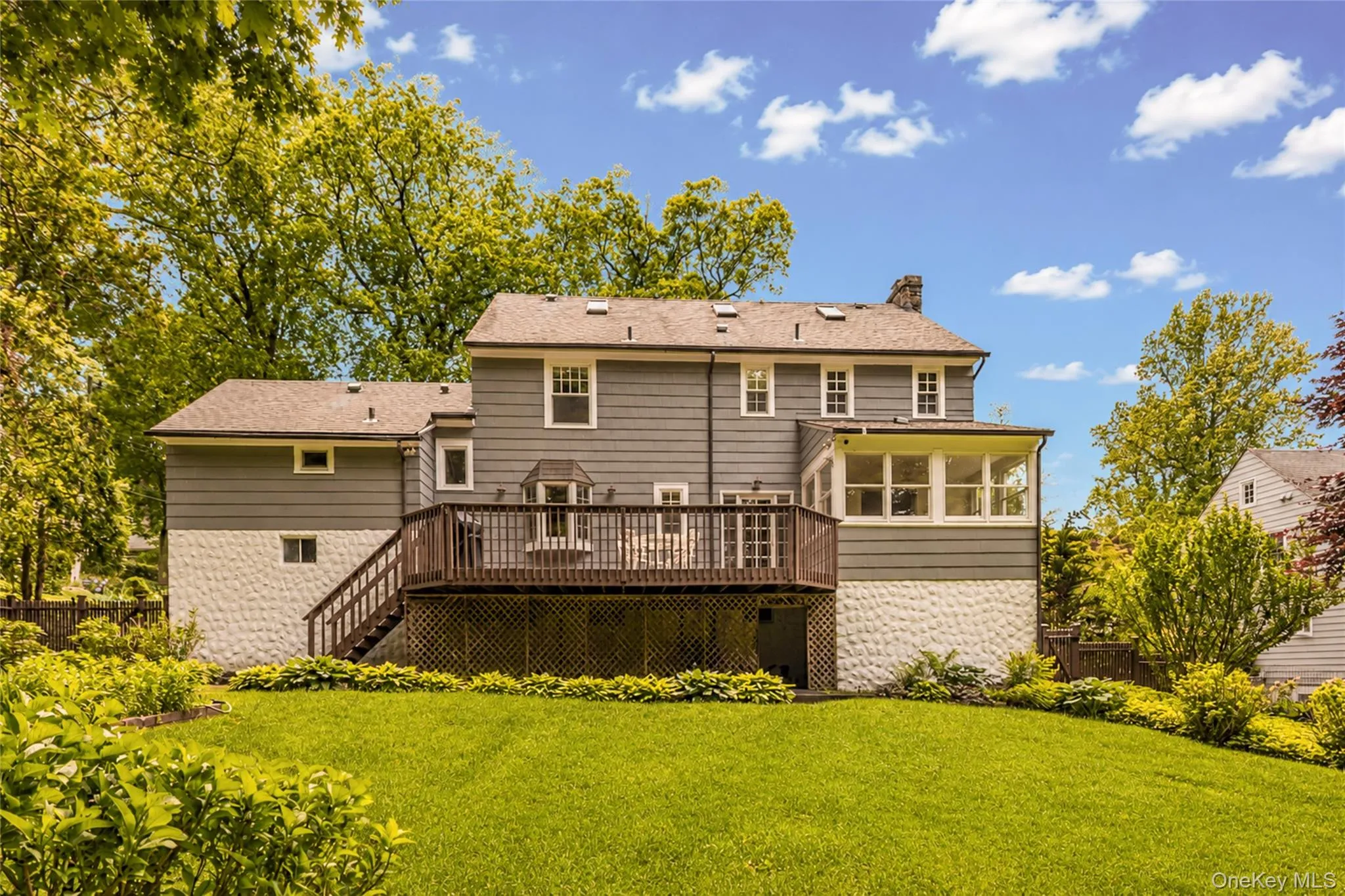 The ample deck overlooks the large private back yard with views of the Huntswoods. The ample deck overlooks the large private back yard with views of the Huntswoods.