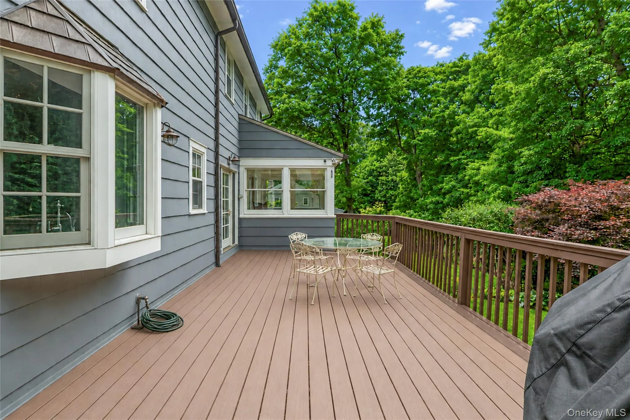 Large deck overlooks the beautifully landscaped back yard. Large deck overlooks the beautifully landscaped back yard.