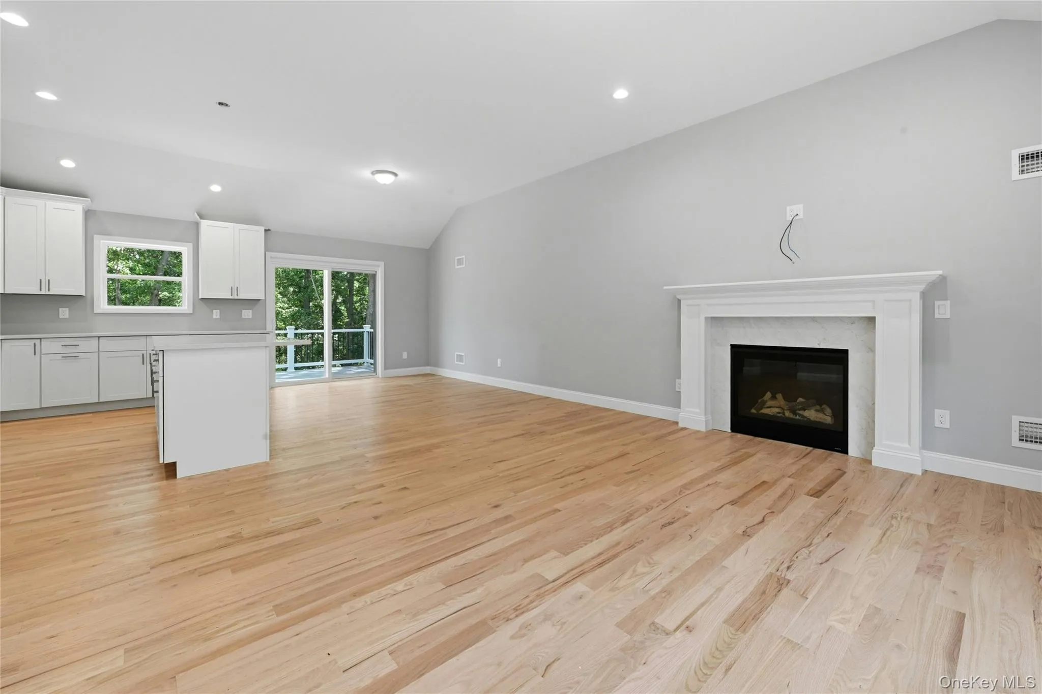 The open-concept layout seamlessly connects the living room, dining area and kitchen, creating an ideal space for everyday living and entertaining. The open-concept layout seamlessly connects the living room, dining area and kitchen, creating an ideal space for everyday living and entertaining.