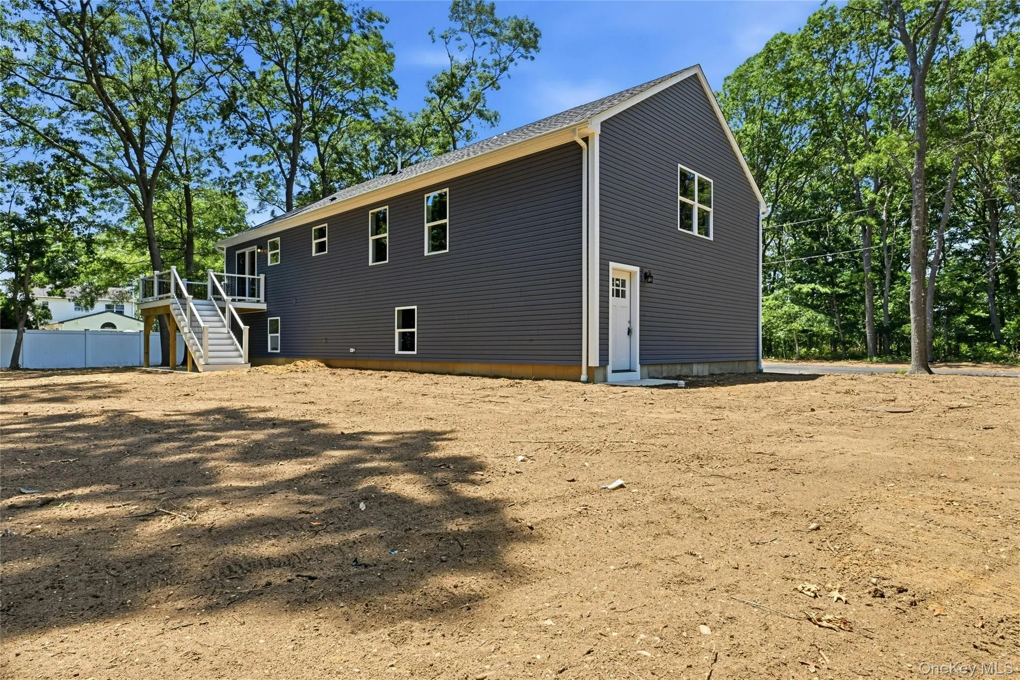 A private side entrance leads to a bright, finished lower level, offering flexible space that's ideal for quests, extended living, or future planning. A private side entrance leads to a bright, finished lower level, offering flexible space that's ideal for quests, extended living, or future planning.