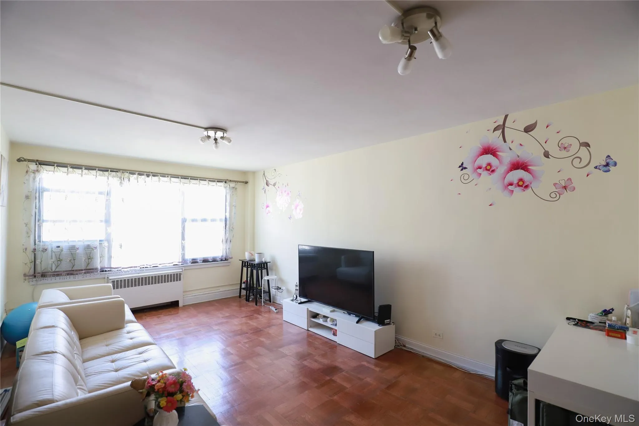 Spacious interior with parquet flooring and light-toned walls Spacious interior with parquet flooring and light-toned walls
