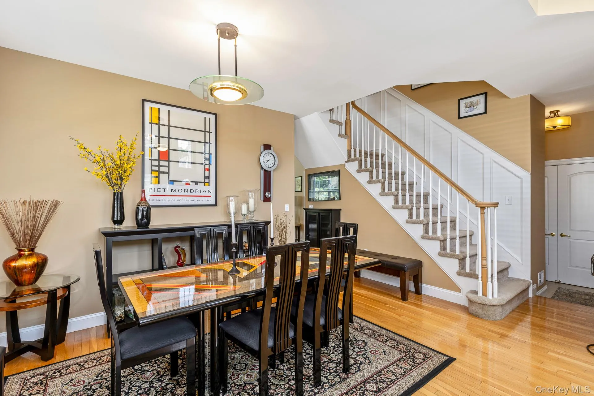 Dining area, featuring a contemporary chandelier Dining area, featuring a contemporary chandelier