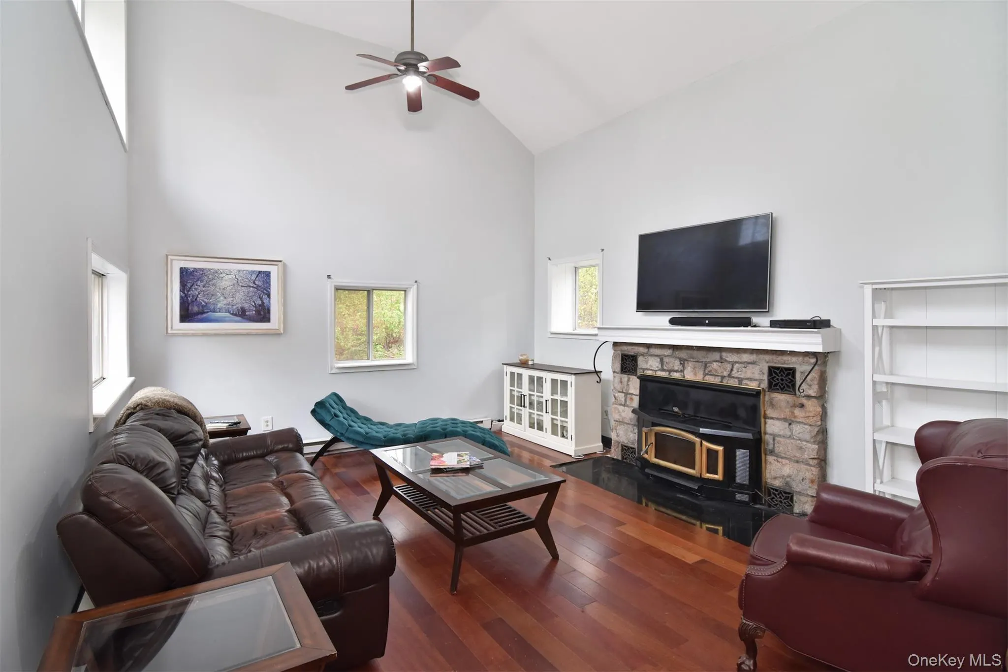Living Room with 16 Foot Ceilings and Wood Burning Fireplace Living Room with 16 Foot Ceilings and Wood Burning Fireplace