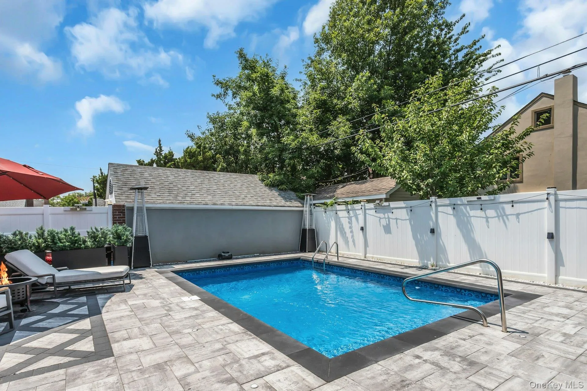 In-ground swimming pool 3' to 6' featuring custom paver perimeter patio In-ground swimming pool 3' to 6' featuring custom paver perimeter patio