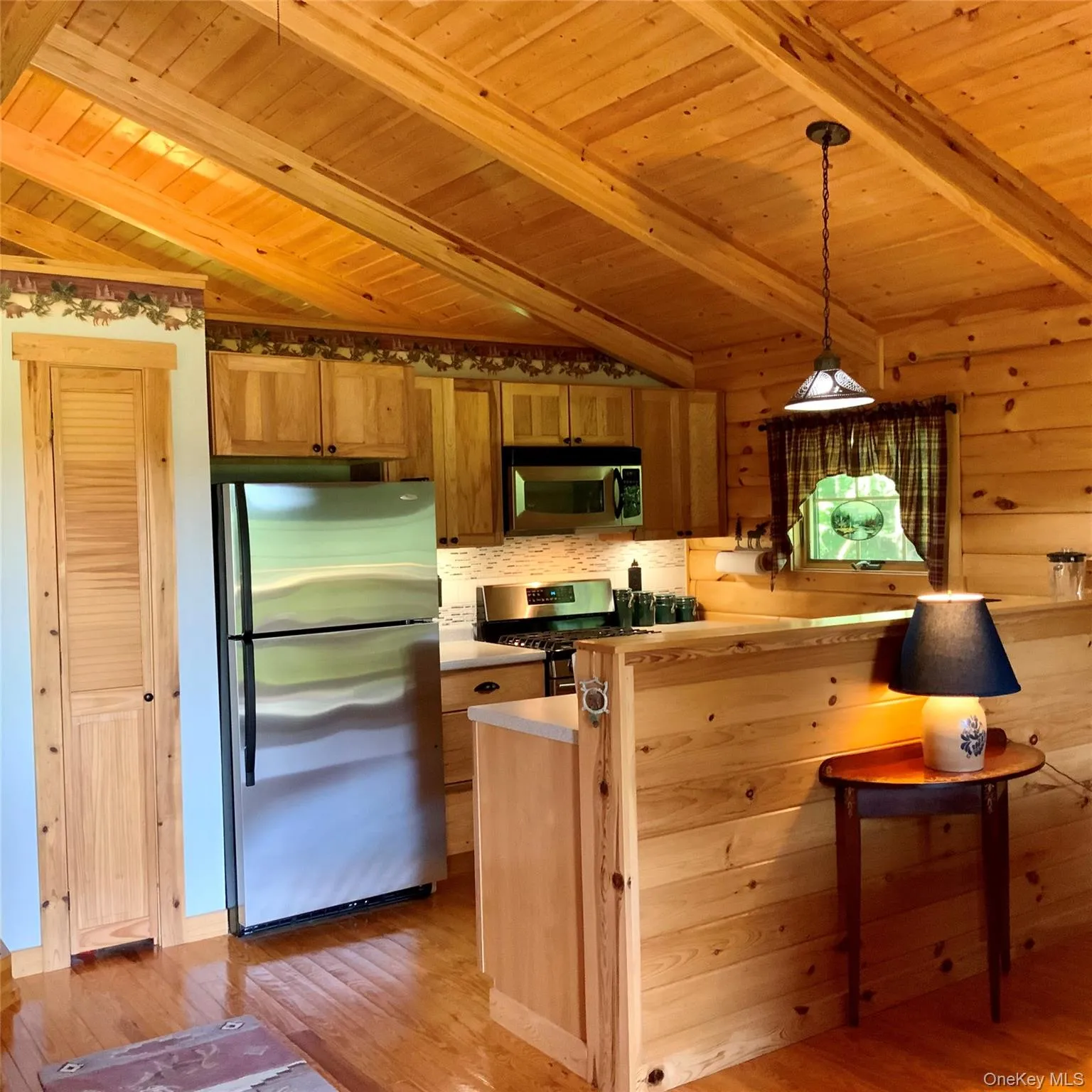 Well-appointed country kitchen with abundant cabinetry and stainless steel appliances. Well-appointed country kitchen with abundant cabinetry and stainless steel appliances.