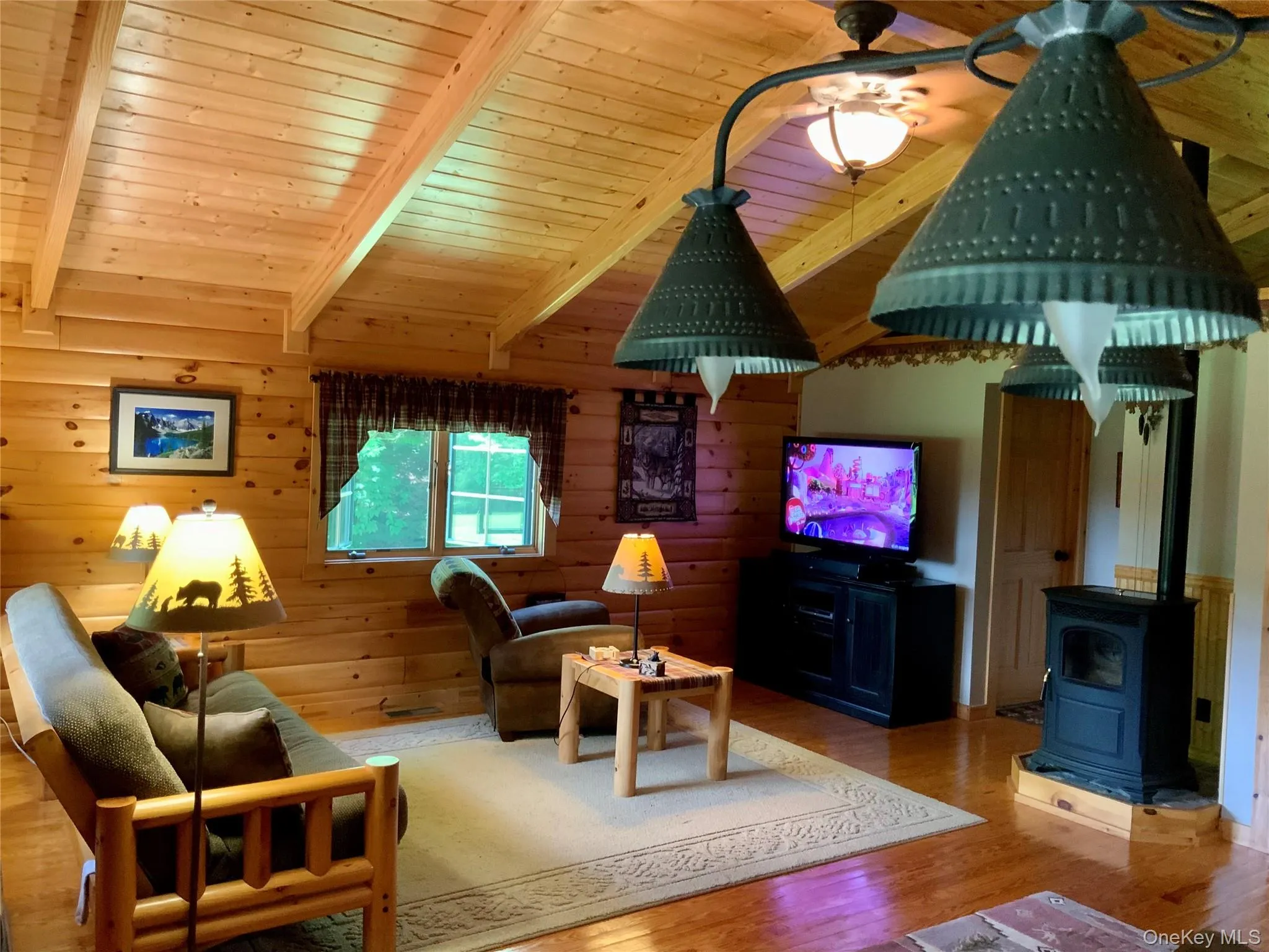 Spacious living area with soaring ceilings and inviting gathering space. Spacious living area with soaring ceilings and inviting gathering space.