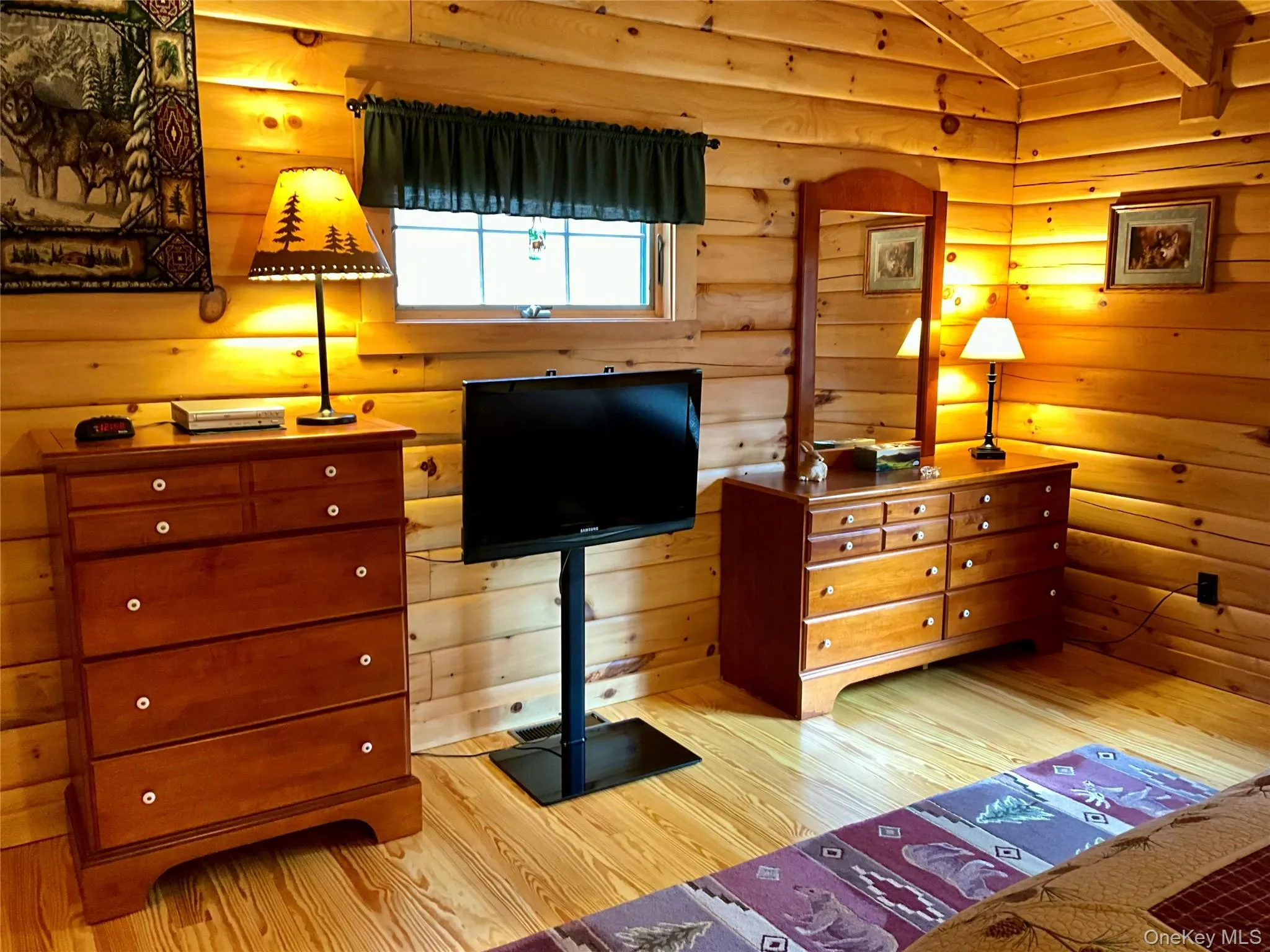 The bedroom showcases natural finishes in this comfortable private retreat. The bedroom showcases natural finishes in this comfortable private retreat.