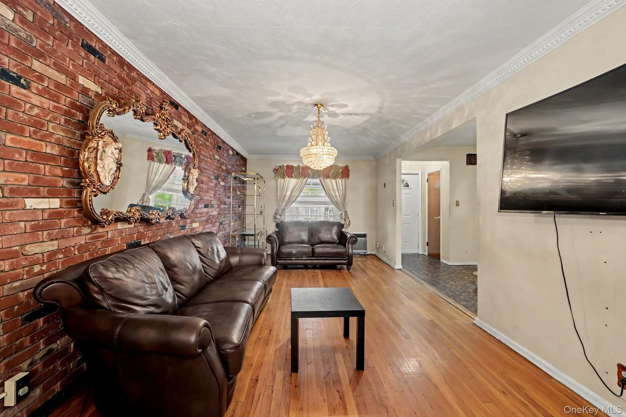 Living room with view to front entrance foyer. Living room with view to front entrance foyer.