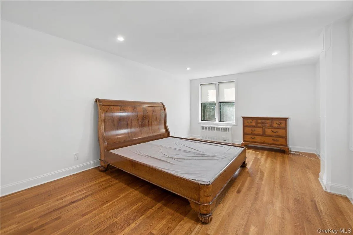 Spacious primary bedroom with recessed lighting Spacious primary bedroom with recessed lighting