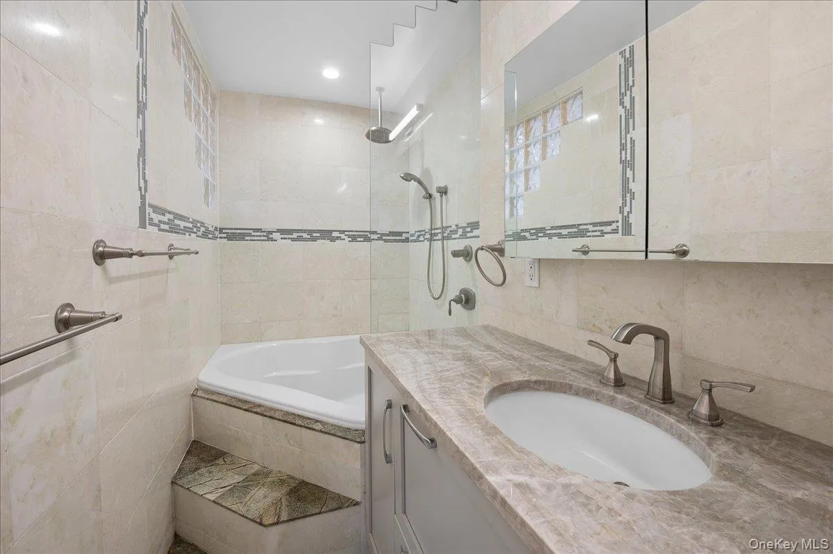Renovated hall bath with soaking tub. Renovated hall bath with soaking tub.