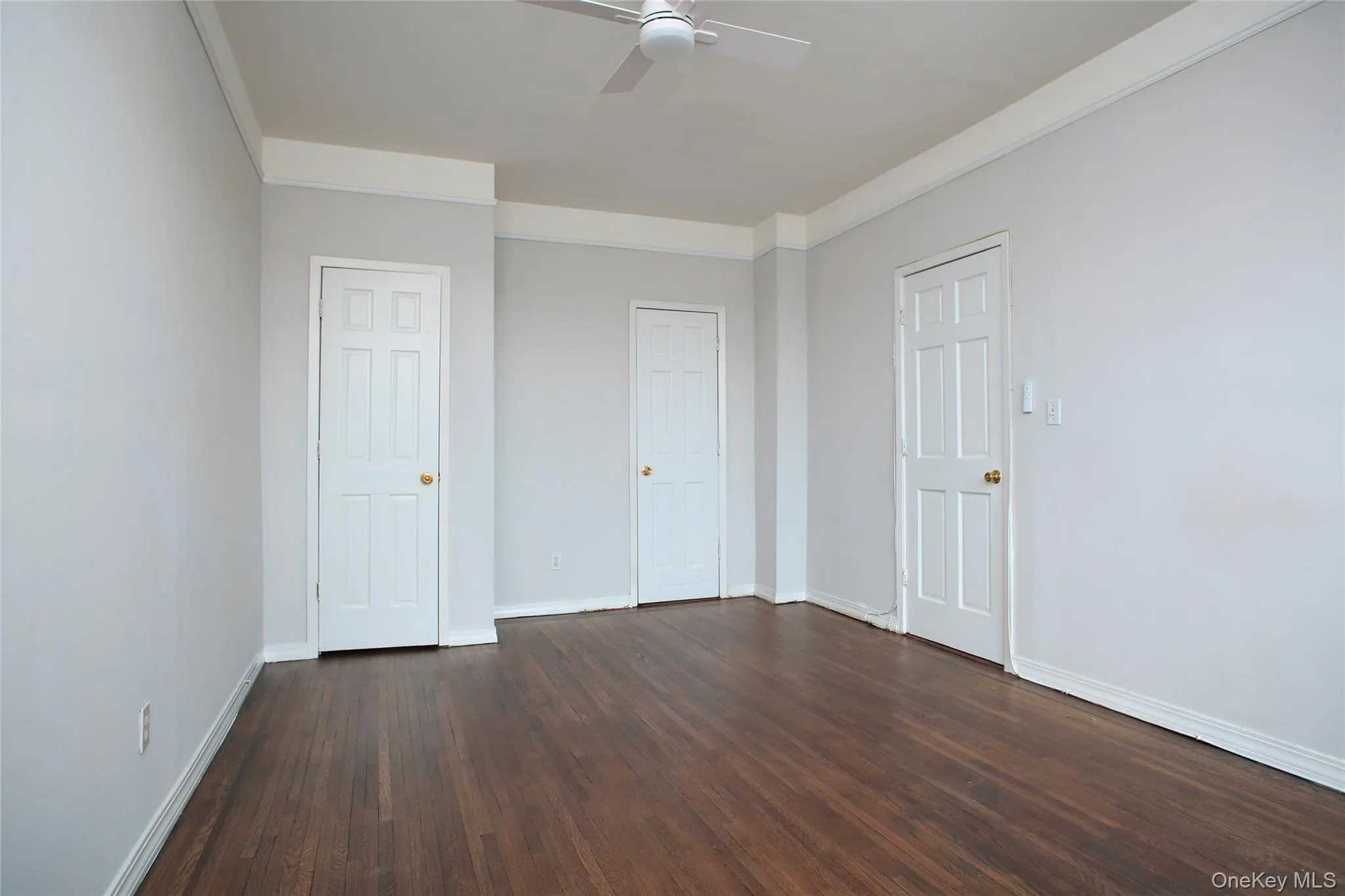 Two closets featuring a walk in closet. Two closets featuring a walk in closet.