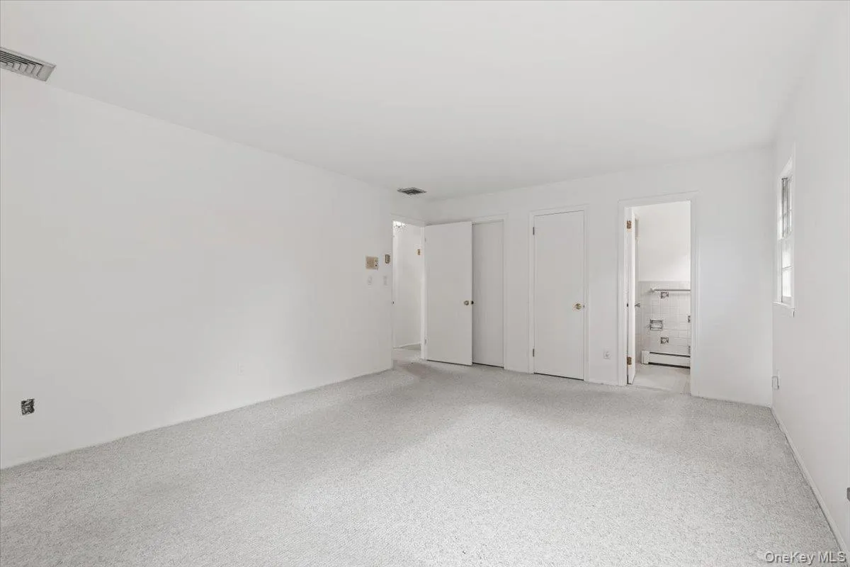 Large primary bedroom features walk-in closet and full bath. Large primary bedroom features walk-in closet and full bath.