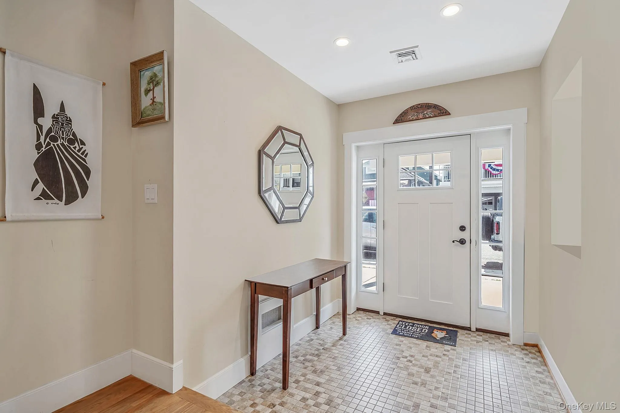 Welcoming entry foyer with abundant natural light and radiant heat Welcoming entry foyer with abundant natural light and radiant heat