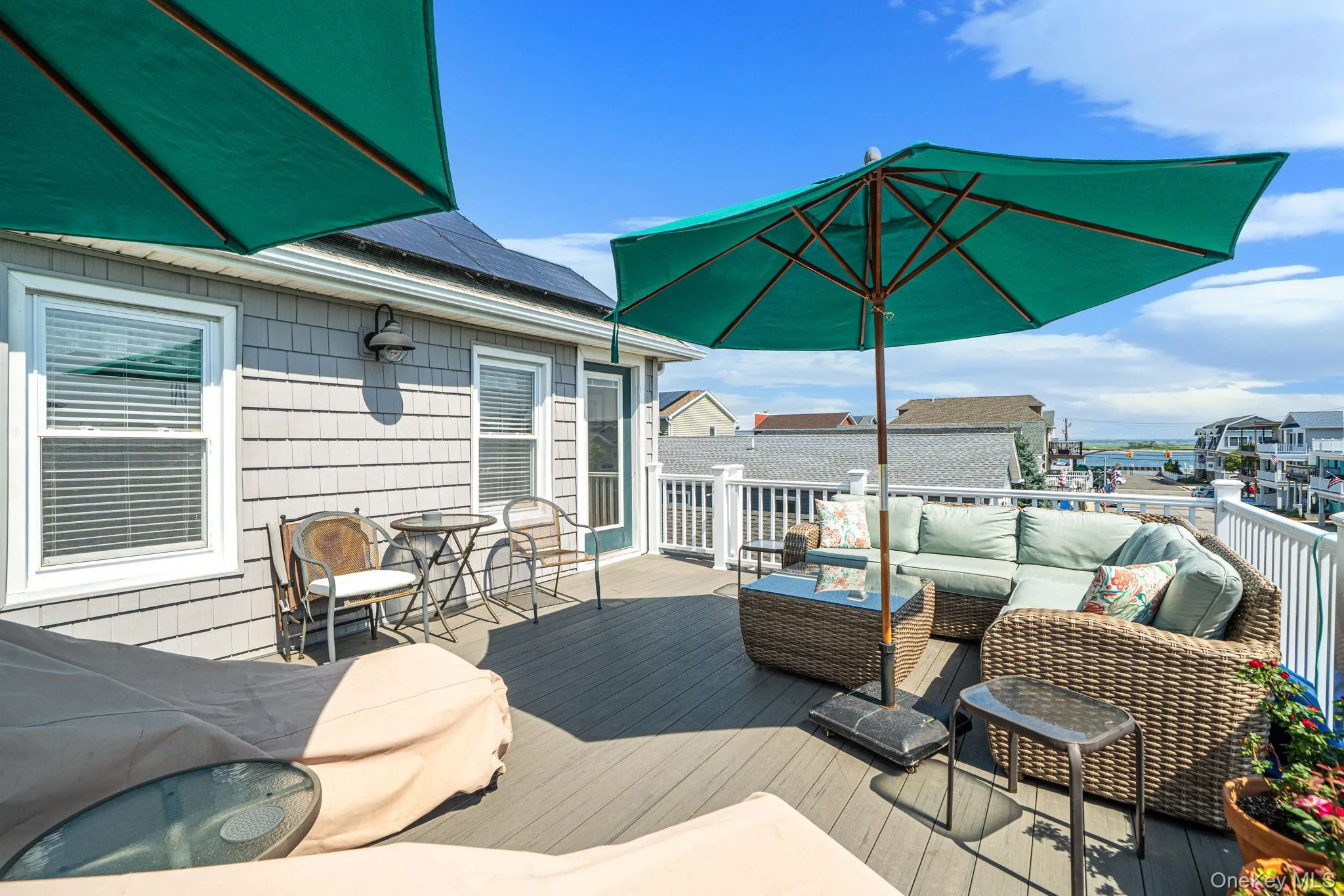Spacious outdoor living area designed to enjoy ocean breezes and coastal sunsets. Spacious outdoor living area designed to enjoy ocean breezes and coastal sunsets.
