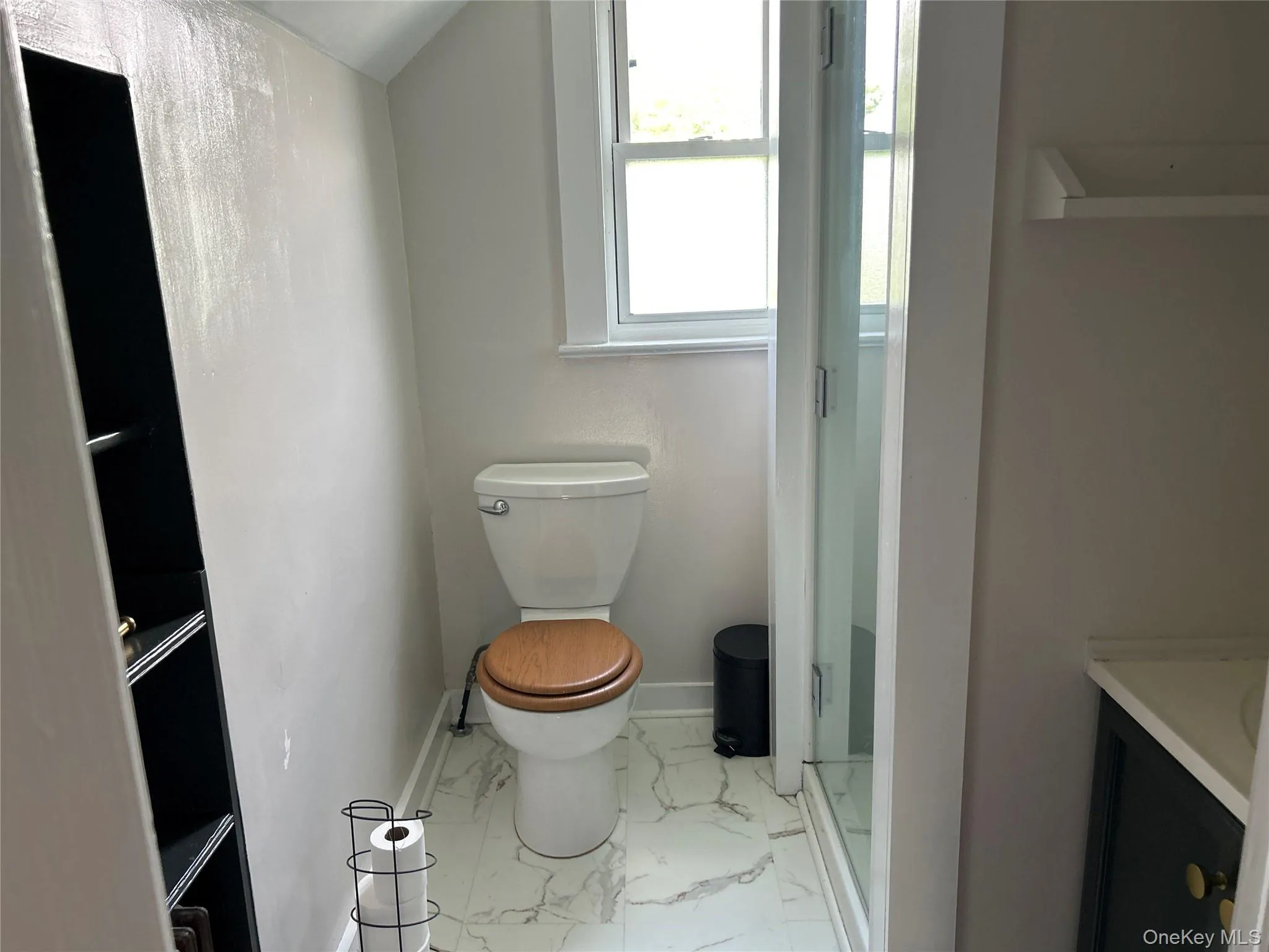 Bath with shower and tiled floor and storage Bath with shower and tiled floor and storage