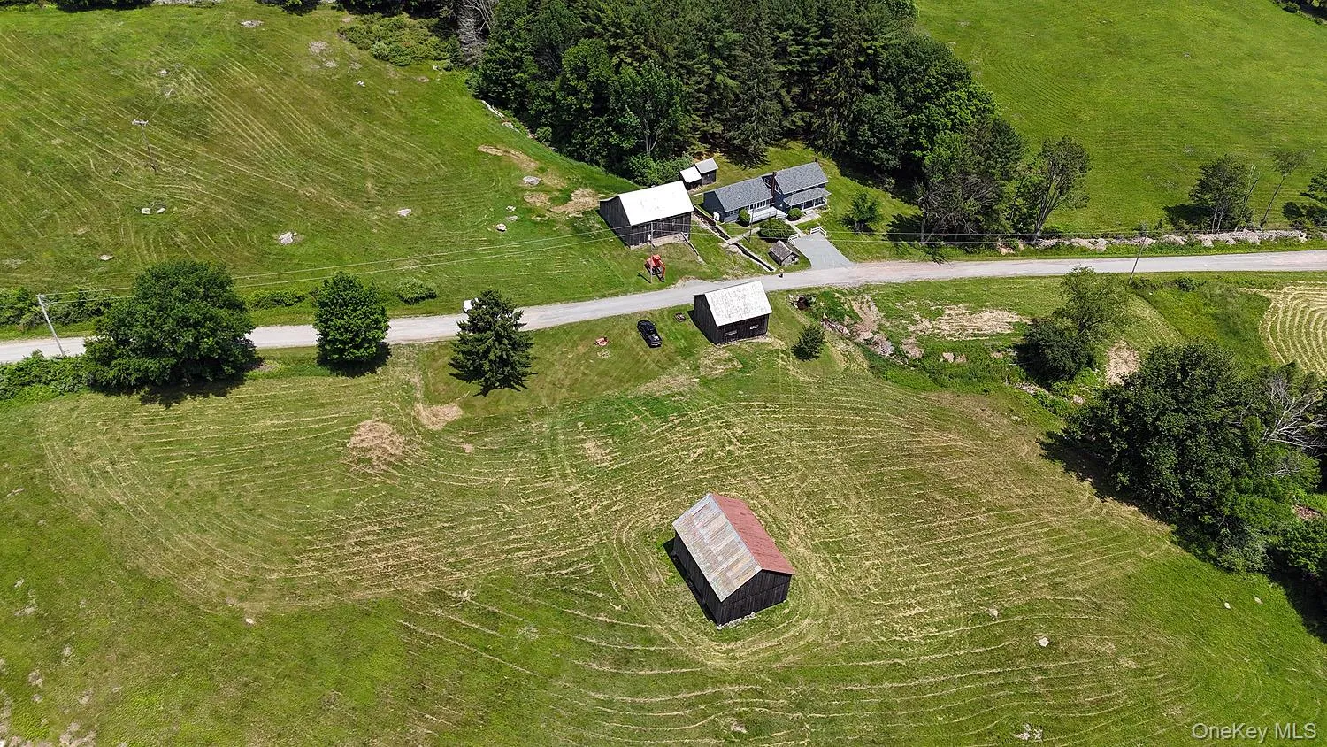 House on right of pic; showing all 3 barns as well and the land layout House on right of pic; showing all 3 barns as well and the land layout