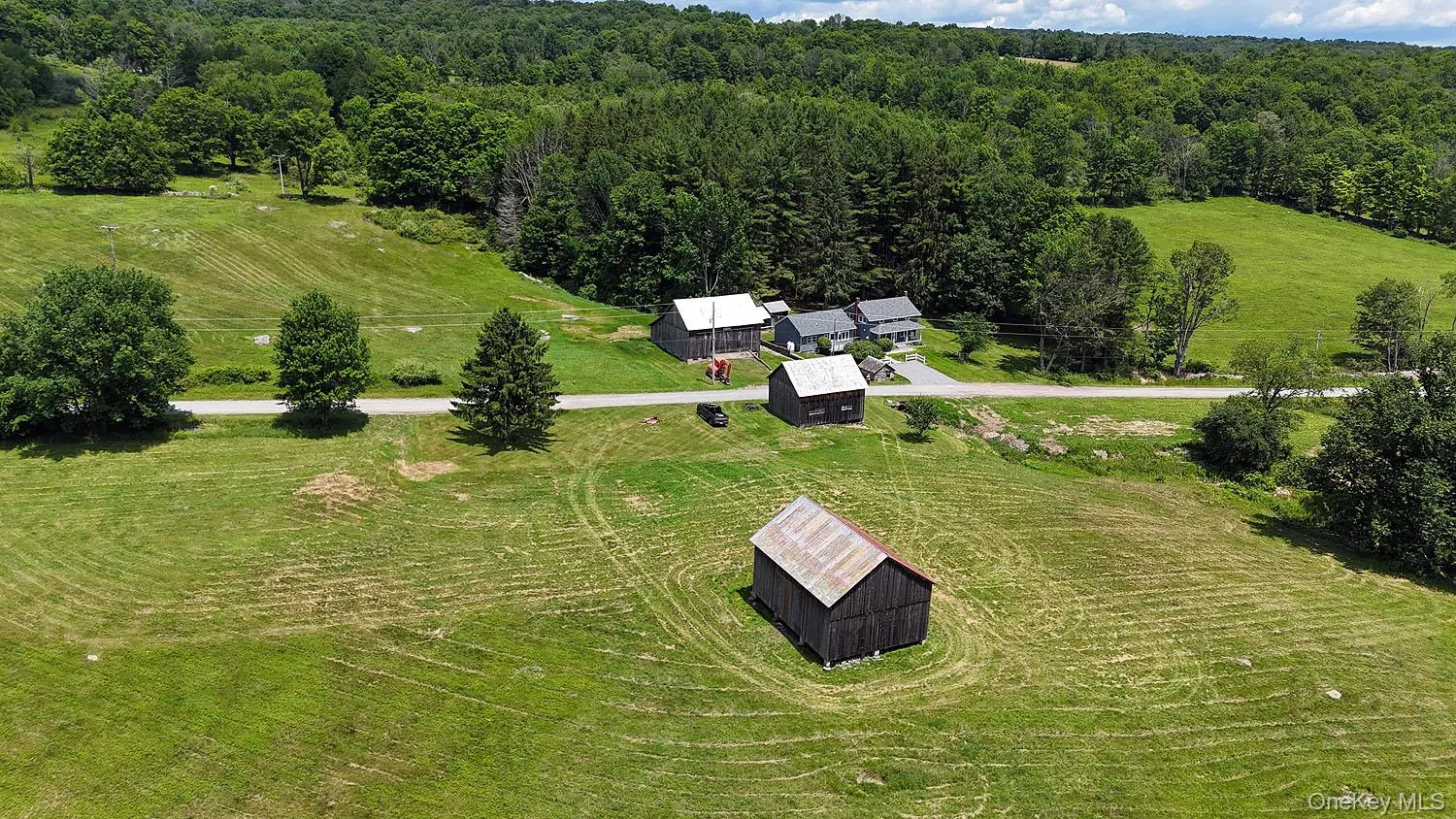 2 barns across the road from the home. 10.6 lush acres! 2 barns across the road from the home. 10.6 lush acres!