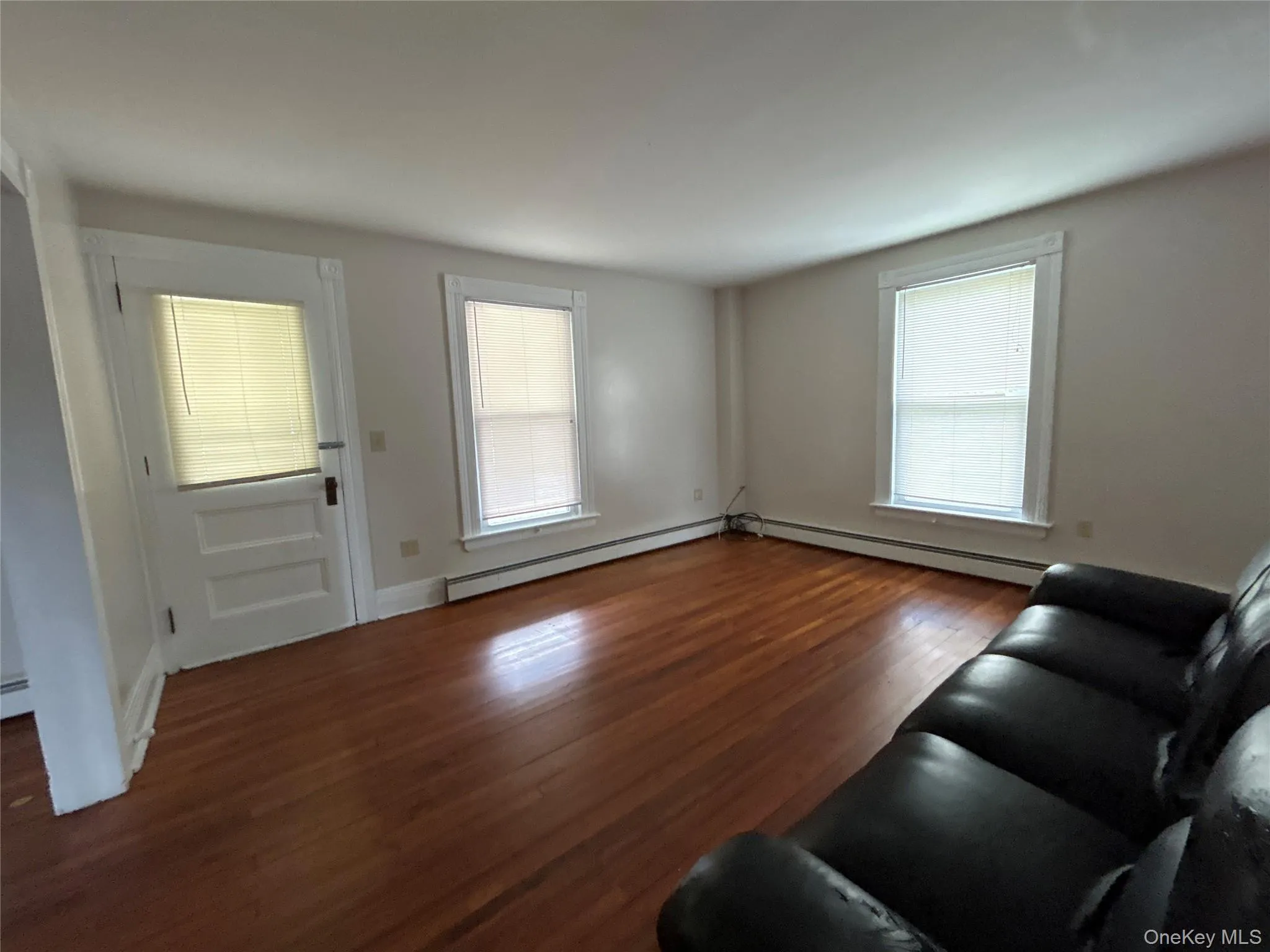 Welcome your guests from the covered porch into your spacious living room with wood floors Welcome your guests from the covered porch into your spacious living room with wood floors