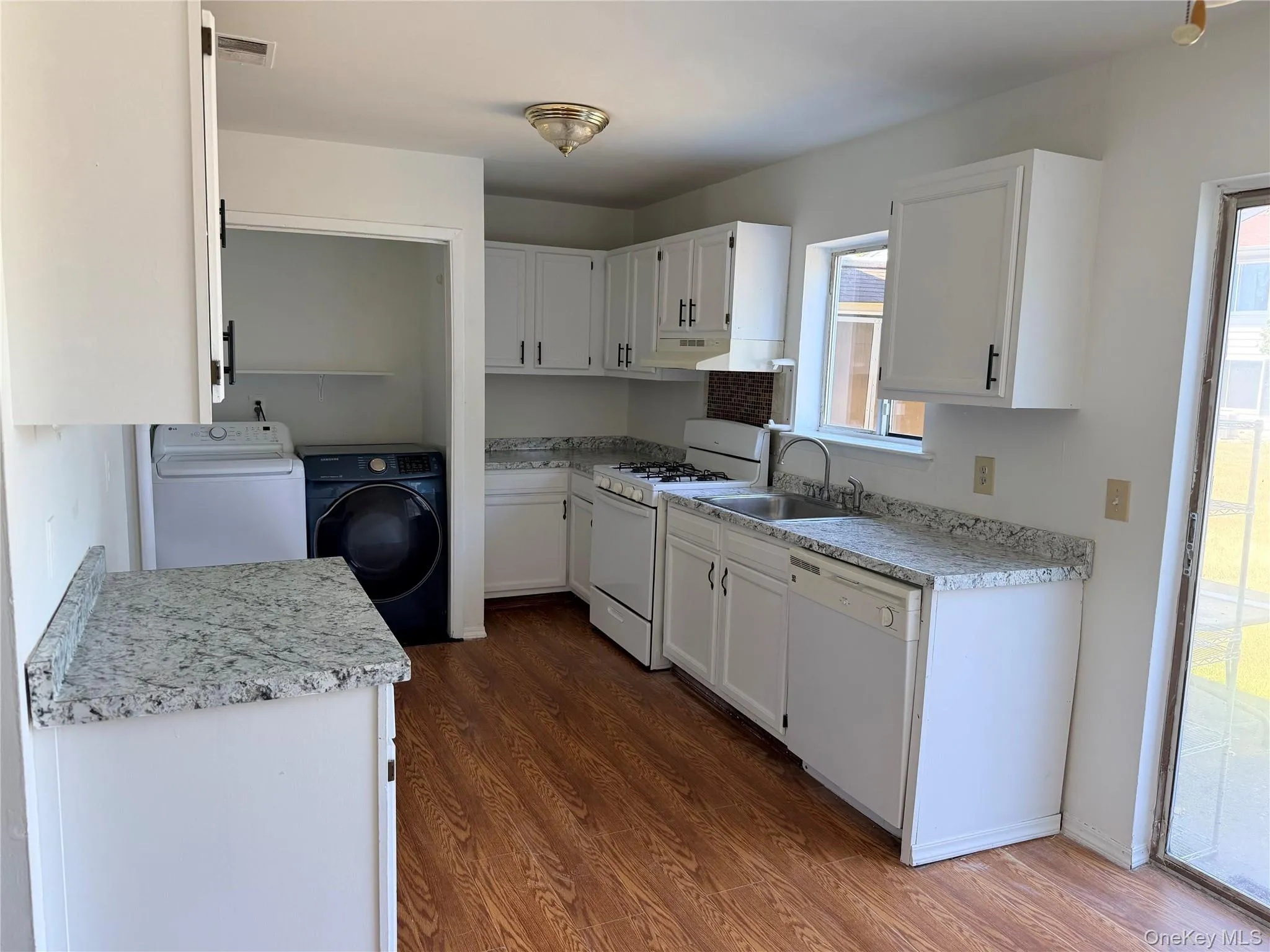 Kitchen with laundry closet Kitchen with laundry closet