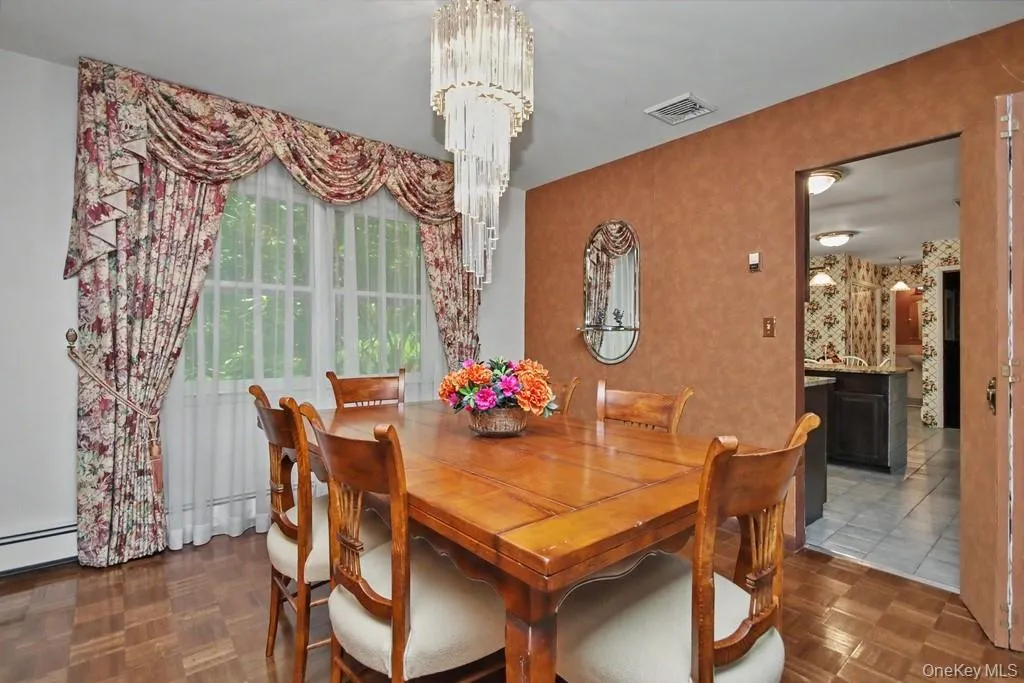 Dining room has parquet floors Dining room has parquet floors