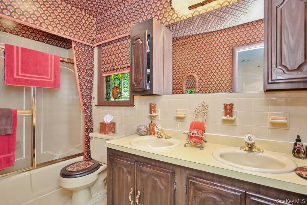 Second Bathroom has double sinks and bathtub shower combo Second Bathroom has double sinks and bathtub shower combo