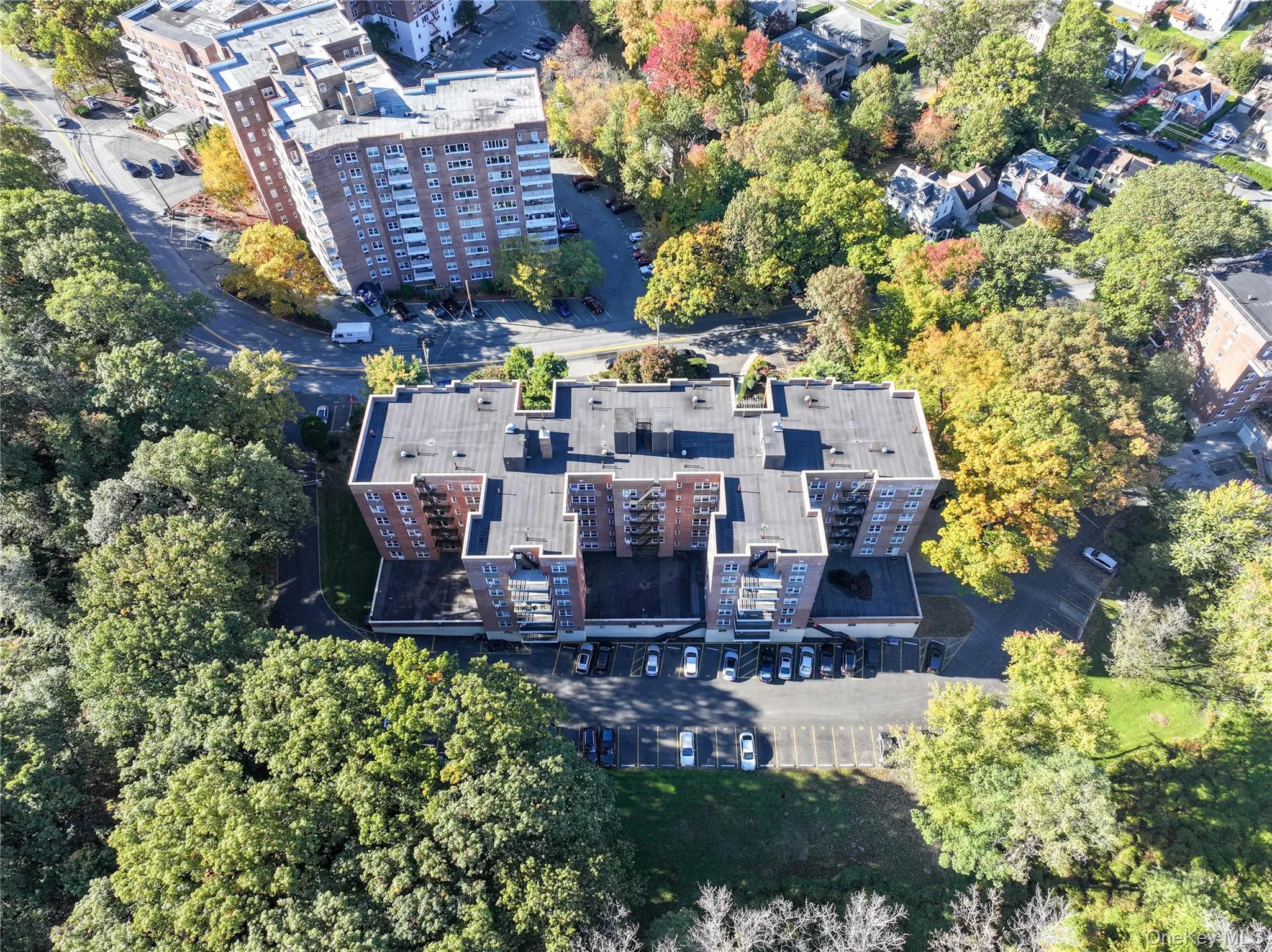 Aerial view of apartment complex and a tree filled landscape Aerial view of apartment complex and a tree filled landscape