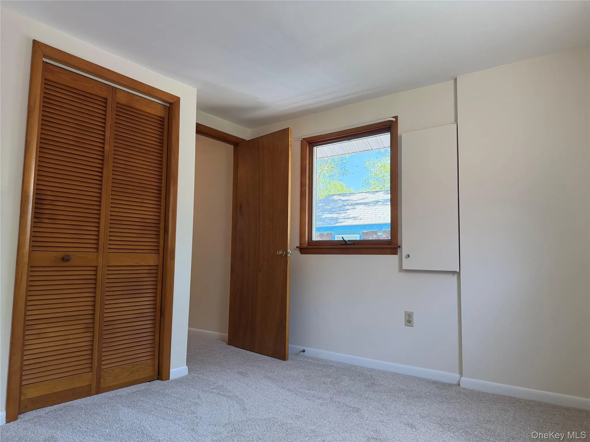 New carpet, window, closet, & A/C wall unit New carpet, window, closet, & A/C wall unit
