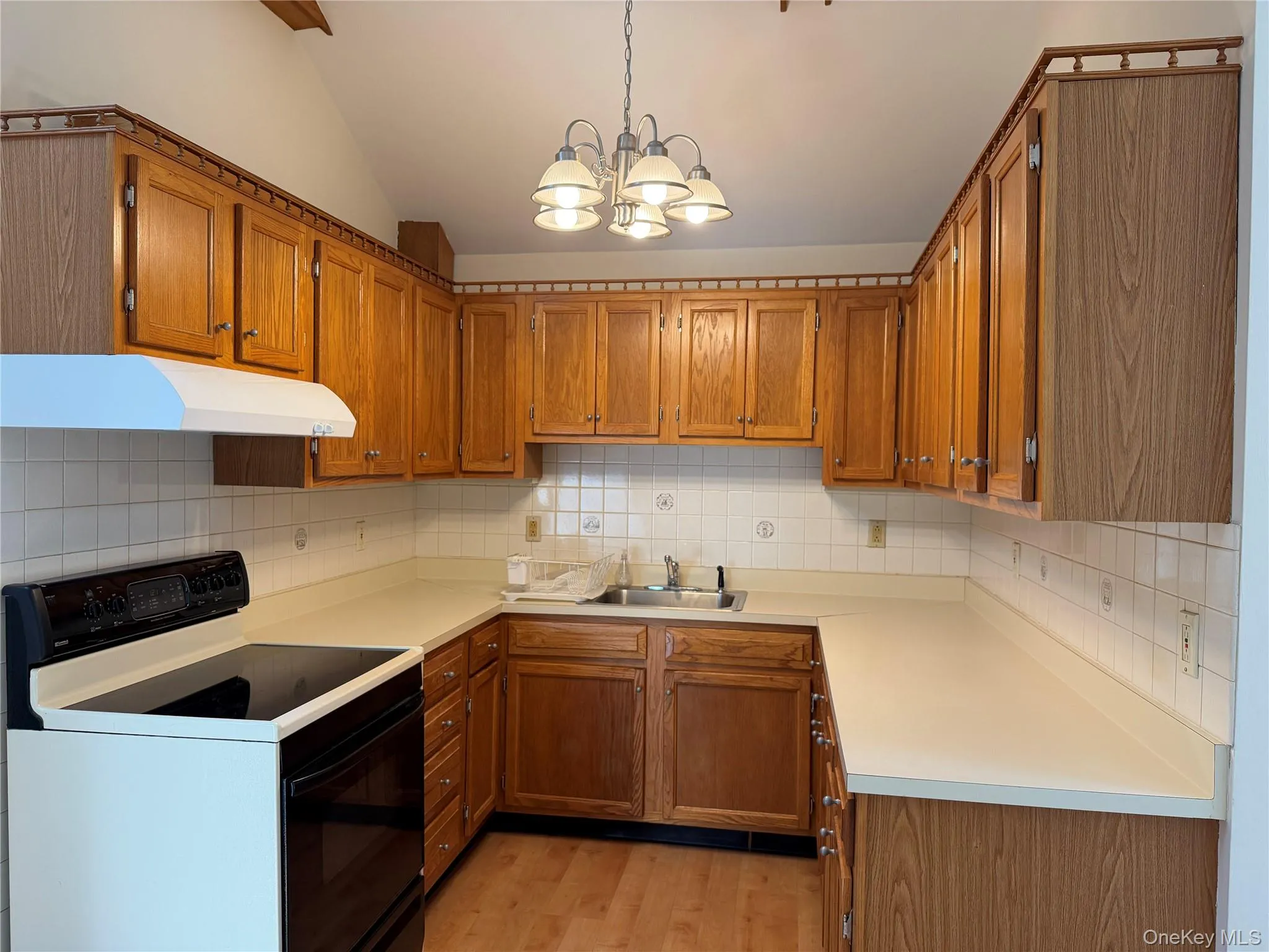 Oak Cabinets, Chandelier, Glass Cook Top Stove Oak Cabinets, Chandelier, Glass Cook Top Stove