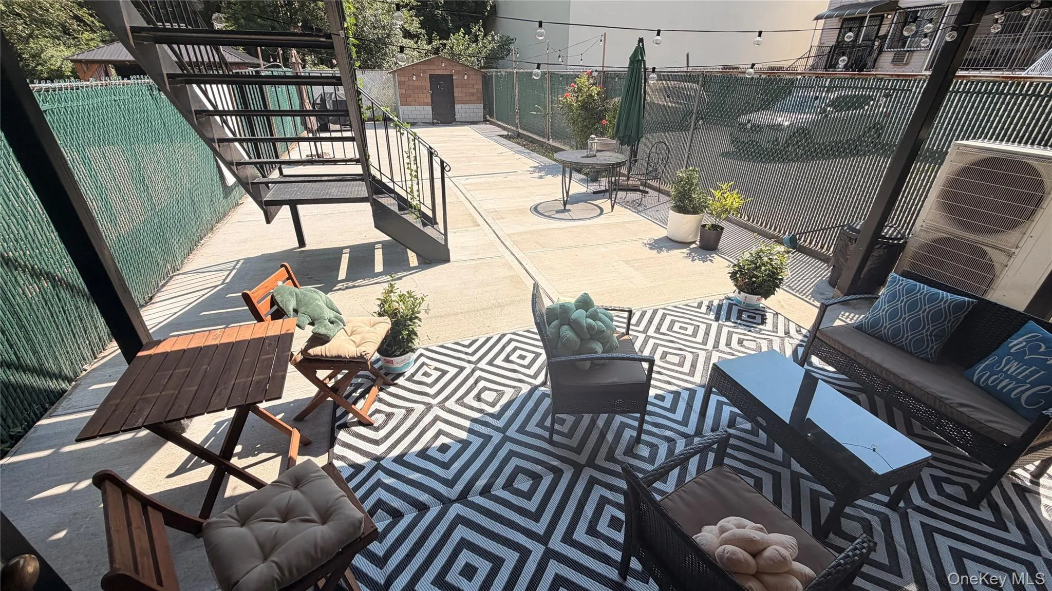 Spacious outdoor patio with concrete flooring Spacious outdoor patio with concrete flooring