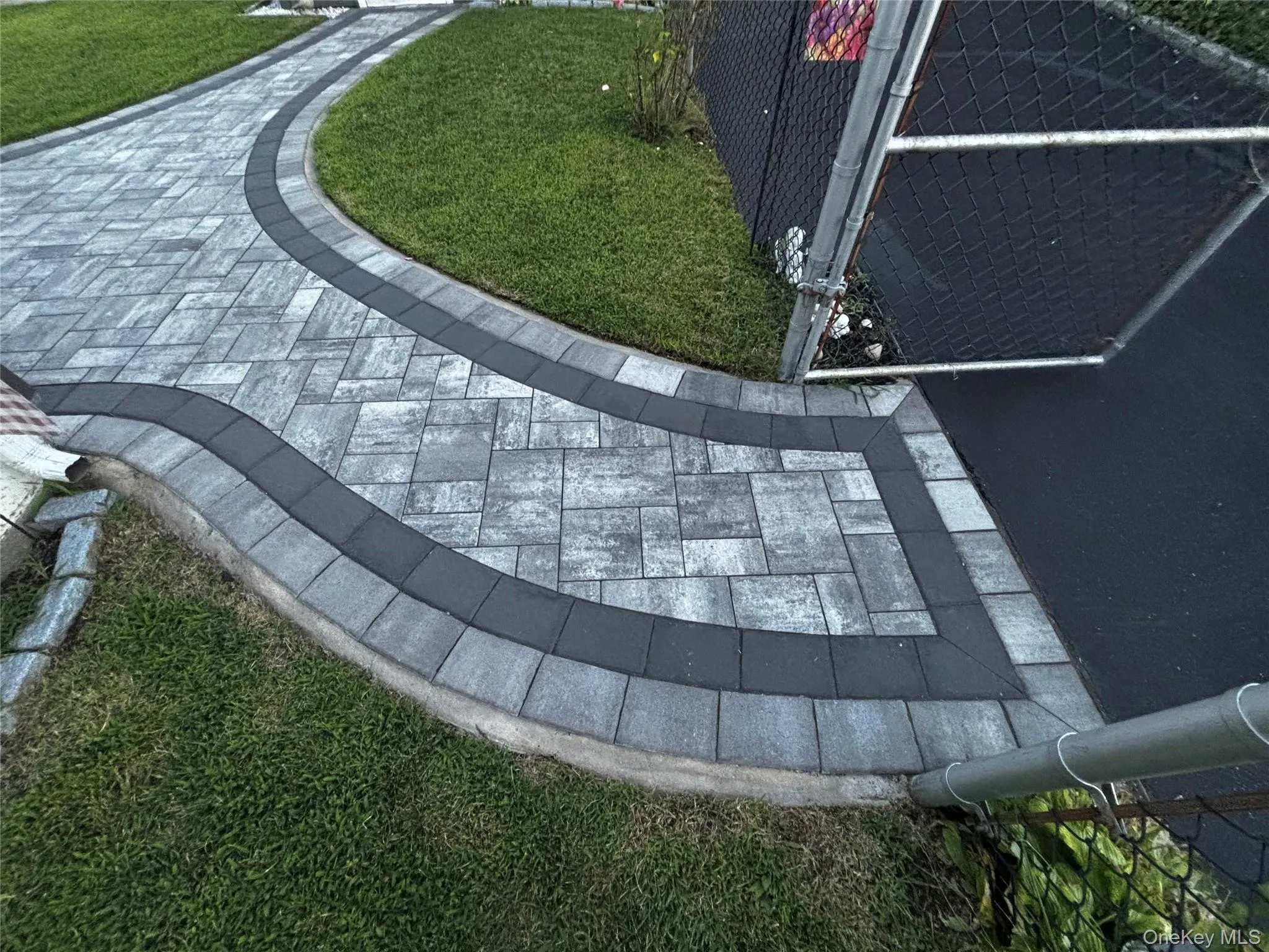 Sidewalk Pavers leading to Garage or Rear Entrance of Home. 2 Years Young and Sealed Professionally. Sidewalk Pavers leading to Garage or Rear Entrance of Home. 2 Years Young and Sealed Professionally.