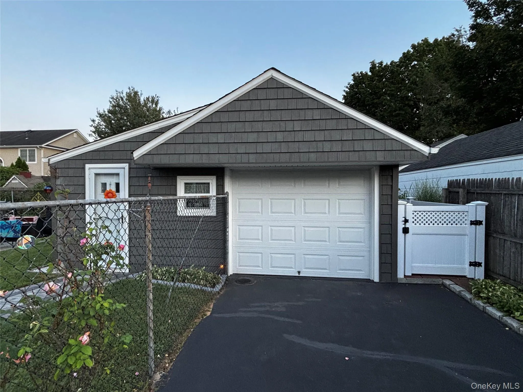 4 car Driveway Leads to Newly Sided Garage w New Windows 4 car Driveway Leads to Newly Sided Garage w New Windows
