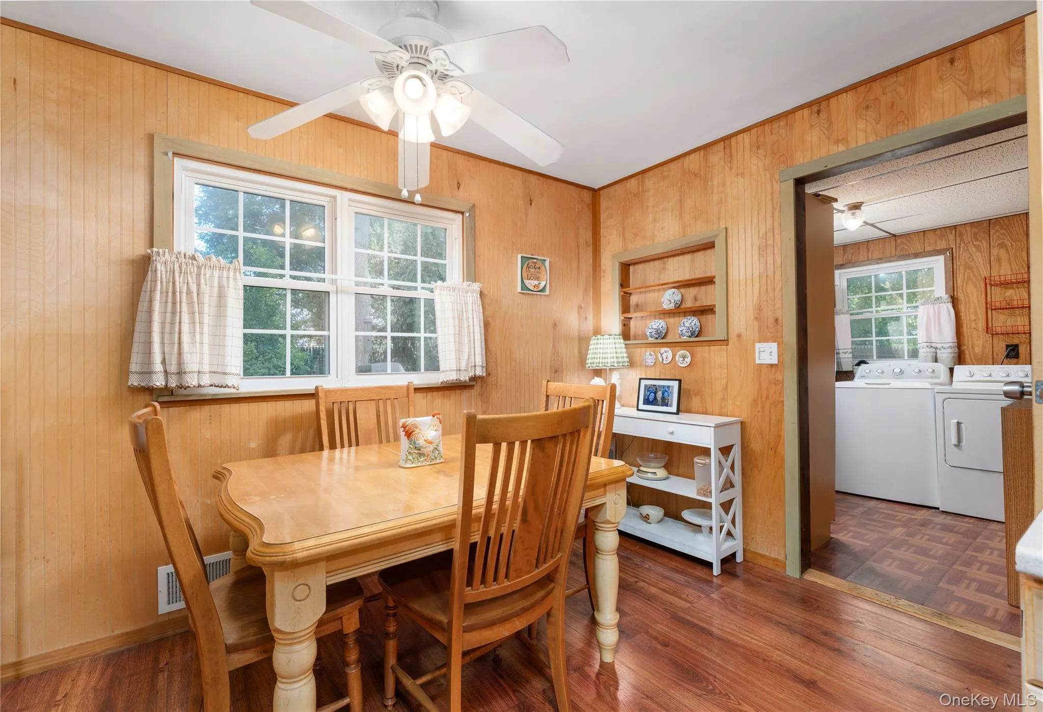 Eat-in Kitchen with ceiling fan, open to laundry, door to lower level on right Eat-in Kitchen with ceiling fan, open to laundry, door to lower level on right