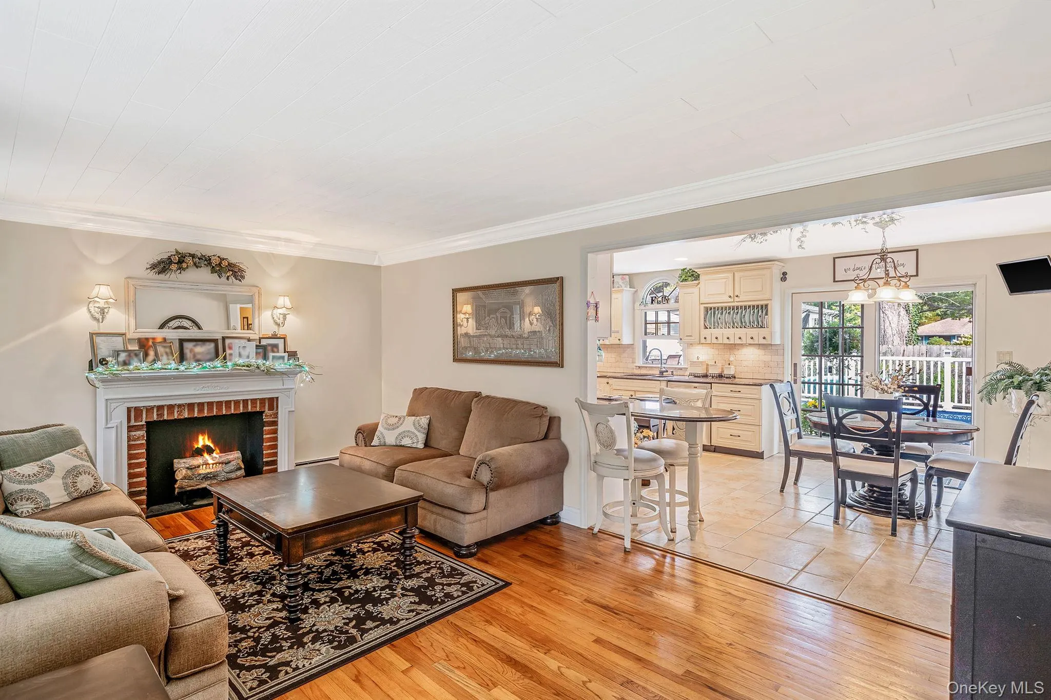 Fireplace is decorative with a electric log set-up Fireplace is decorative with a electric log set-up