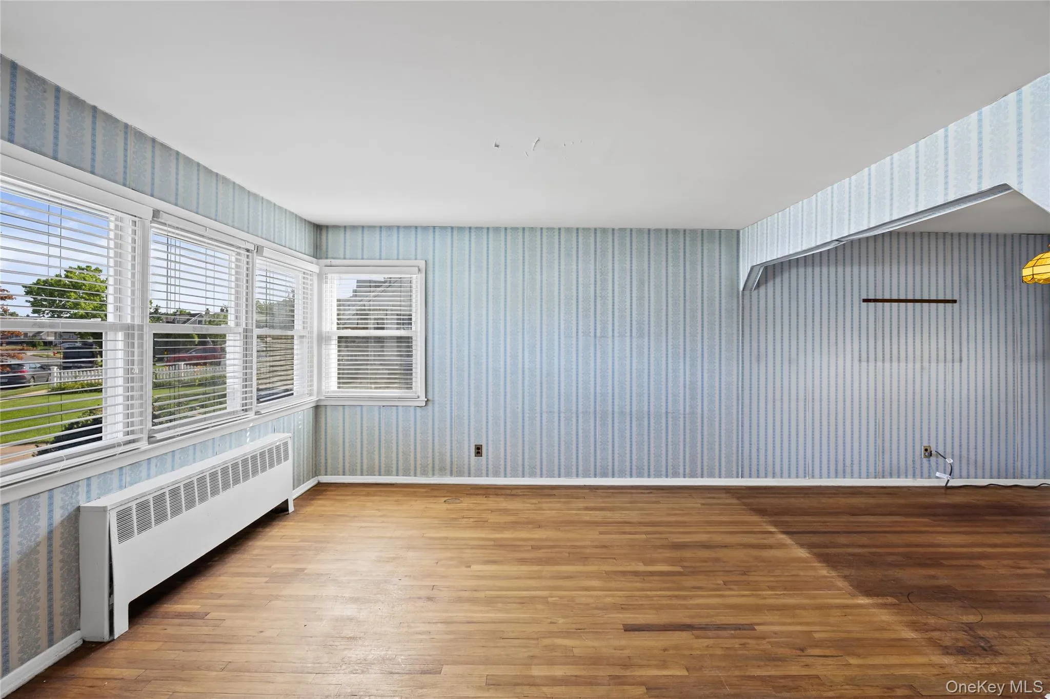 Formal Living room hrdwood floors, great light, L-Shape into dining-room Formal Living room hrdwood floors, great light, L-Shape into dining-room