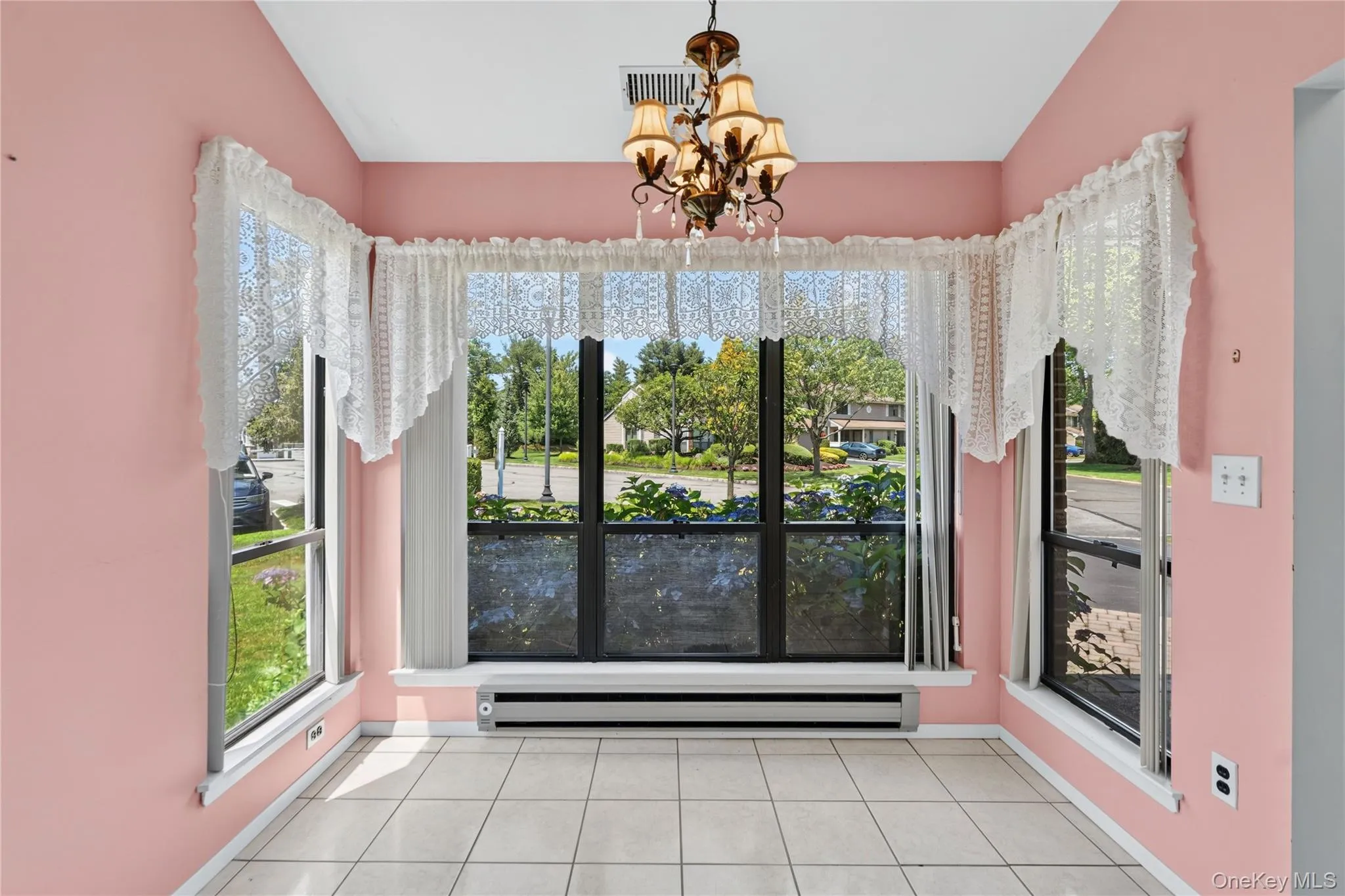 Breakfast with a lovely view of landscaping and walls of windows. Breakfast with a lovely view of landscaping and walls of windows.