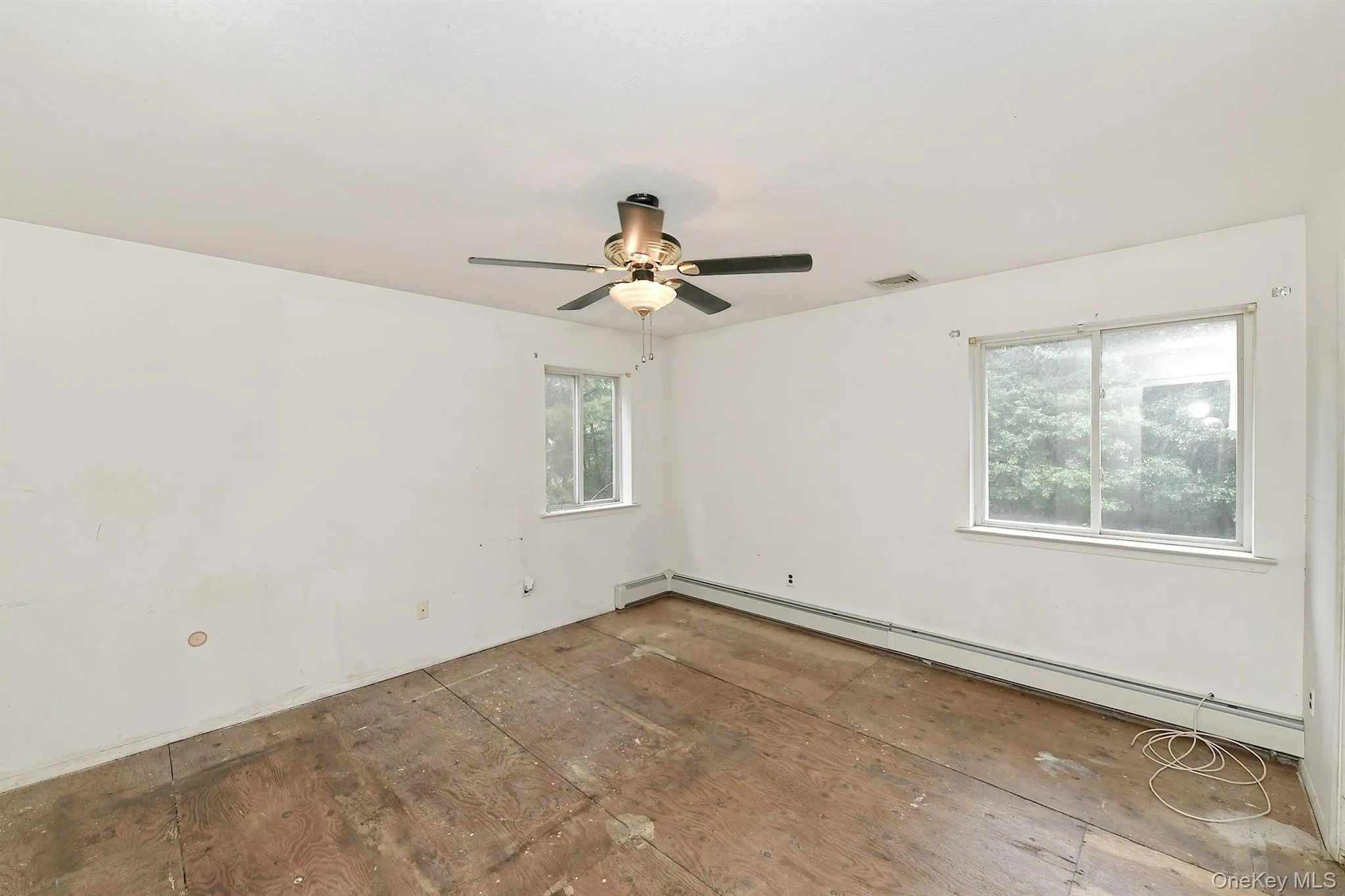 Spacious Primary Bedroom With Ceiling Fan Spacious Primary Bedroom With Ceiling Fan