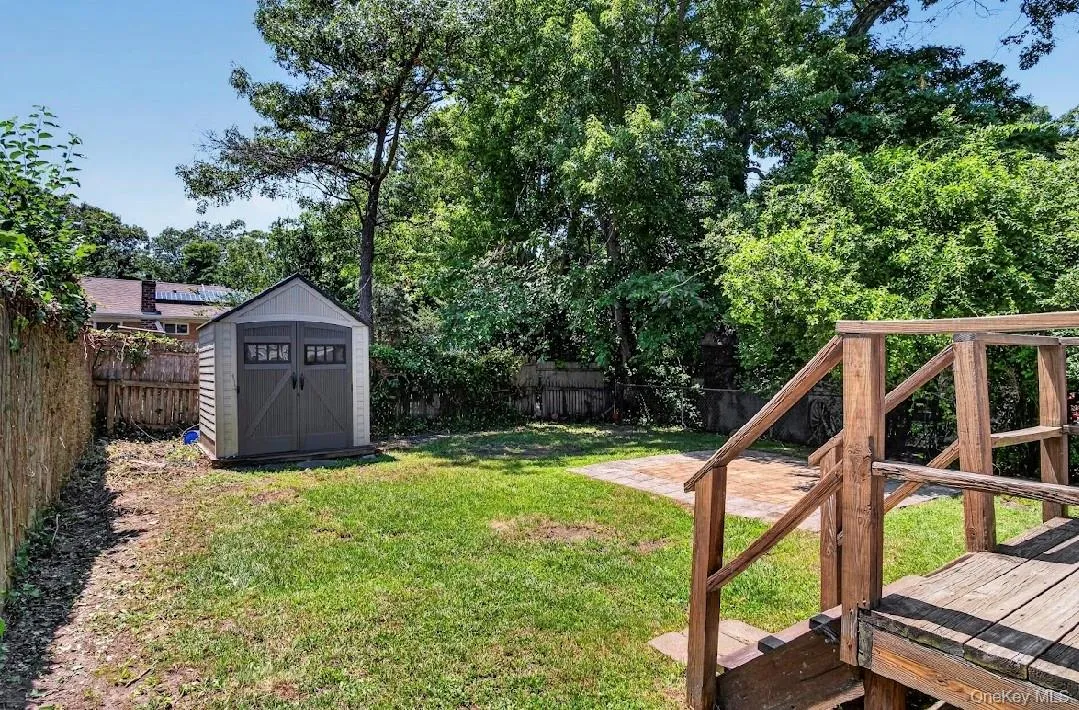 Backyard with storage shed. Backyard with storage shed.