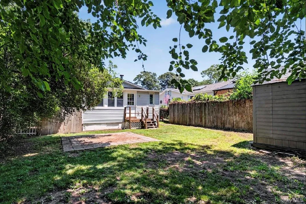 Backyard, patio, and storage shed. Backyard, patio, and storage shed.